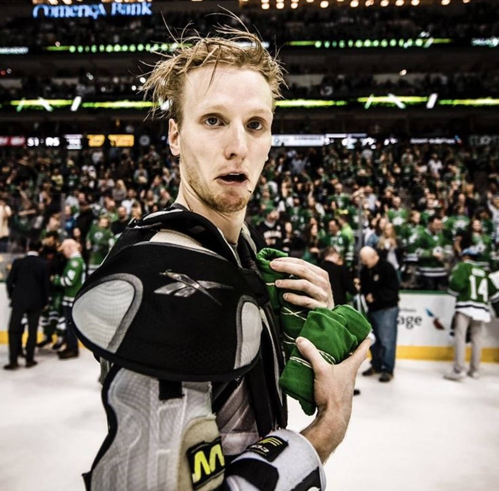 Dynamic Nhl Star - John Klingberg Removing His Jersey Background