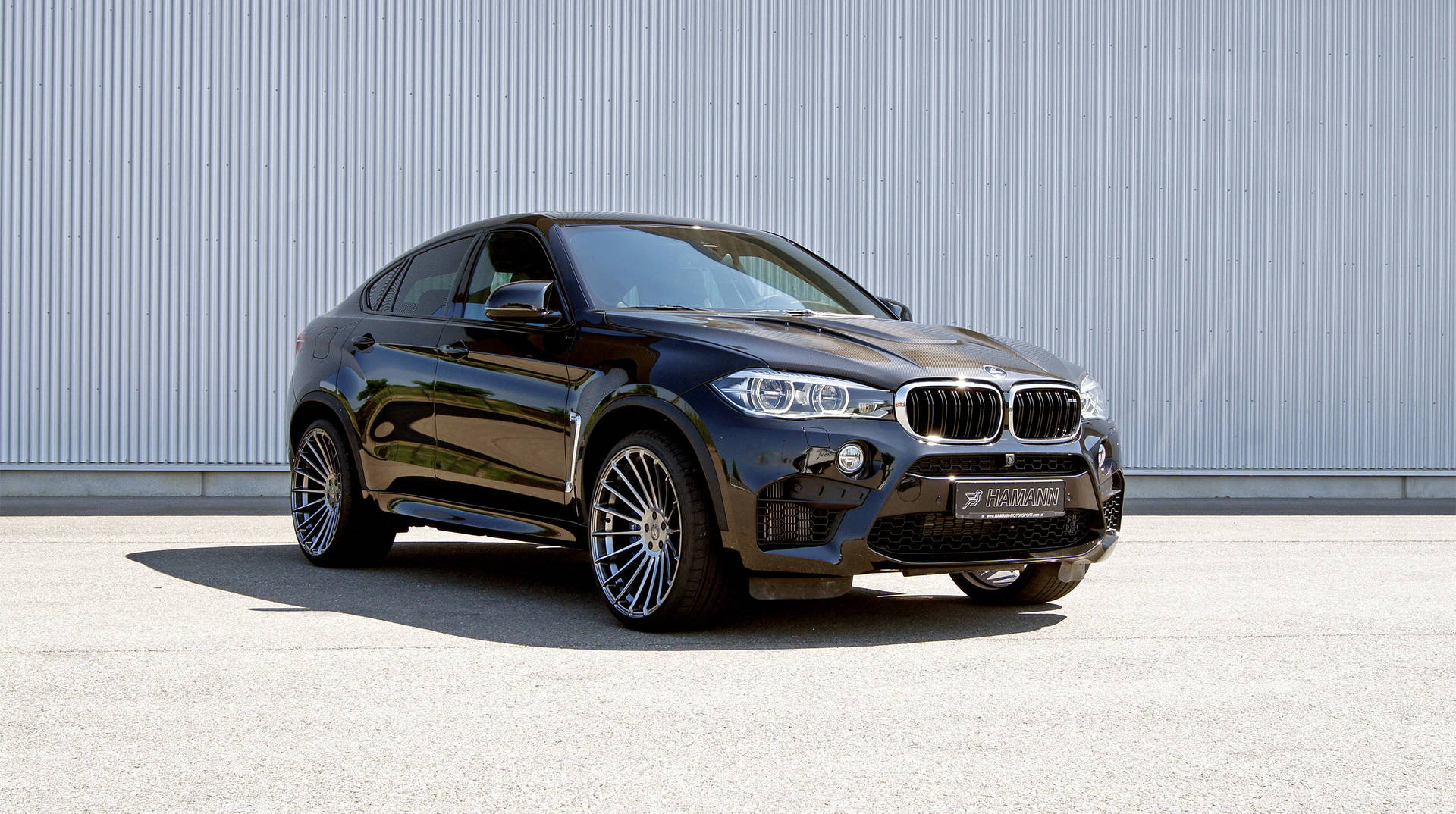 Dynamic Power Meets Luxury: A Sun-kissed Bmw X6 M Background