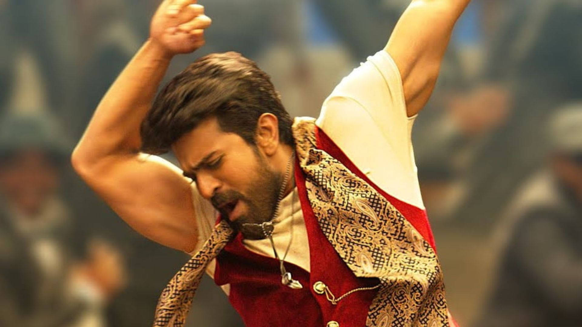 Dynamic Ram Charan Exhibiting His Dance Moves In Hd. Background