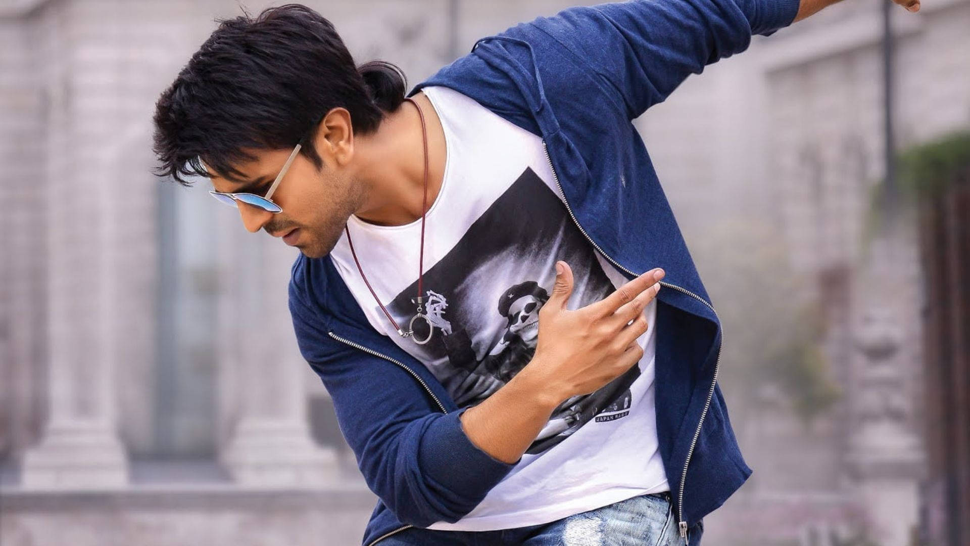 Dynamic Ram Charan In Full Swing - A Candid Shot From A Street Dance Scene. Background