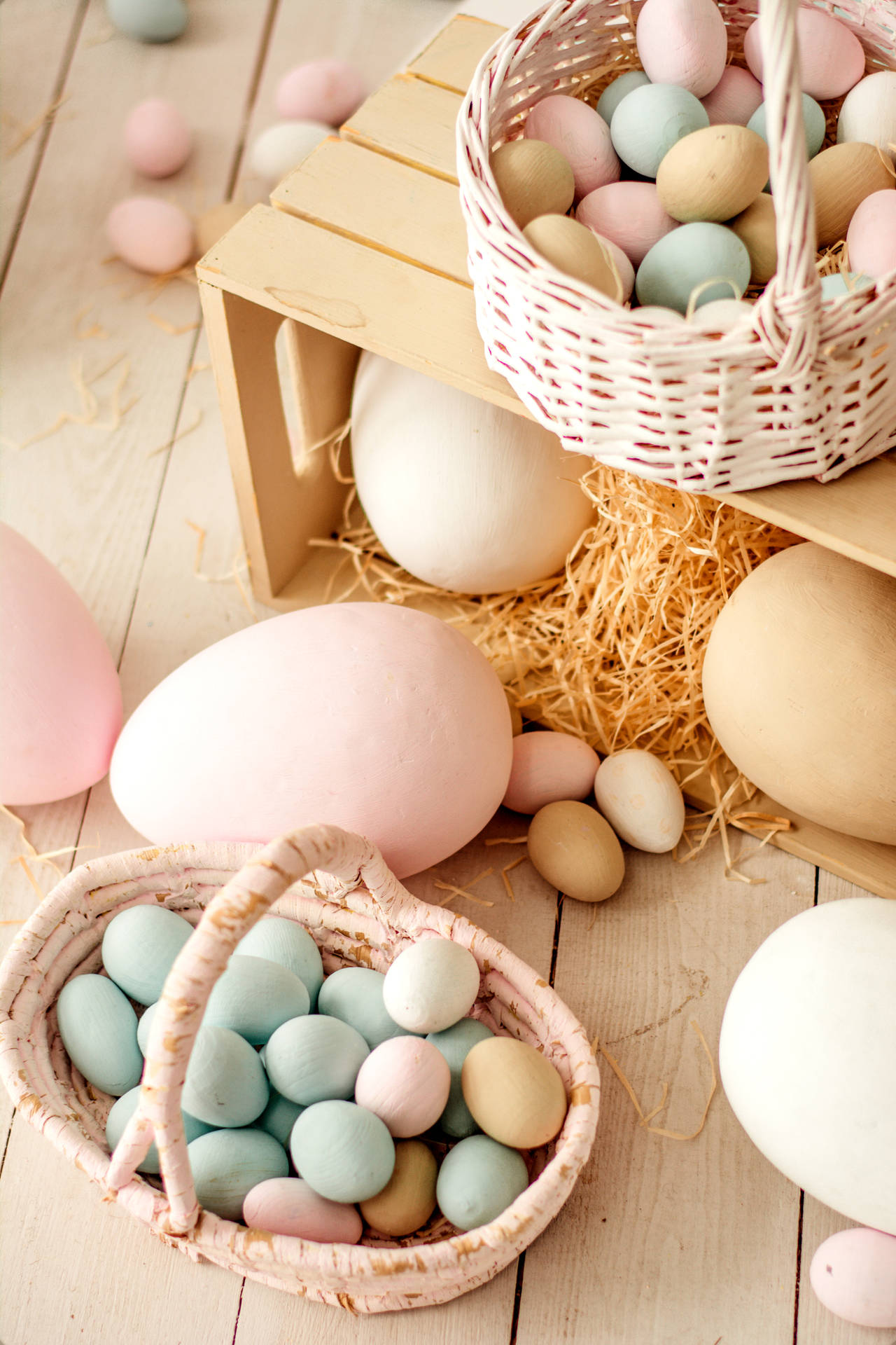 Easter Eggs In Baskets On A Wooden Table Background