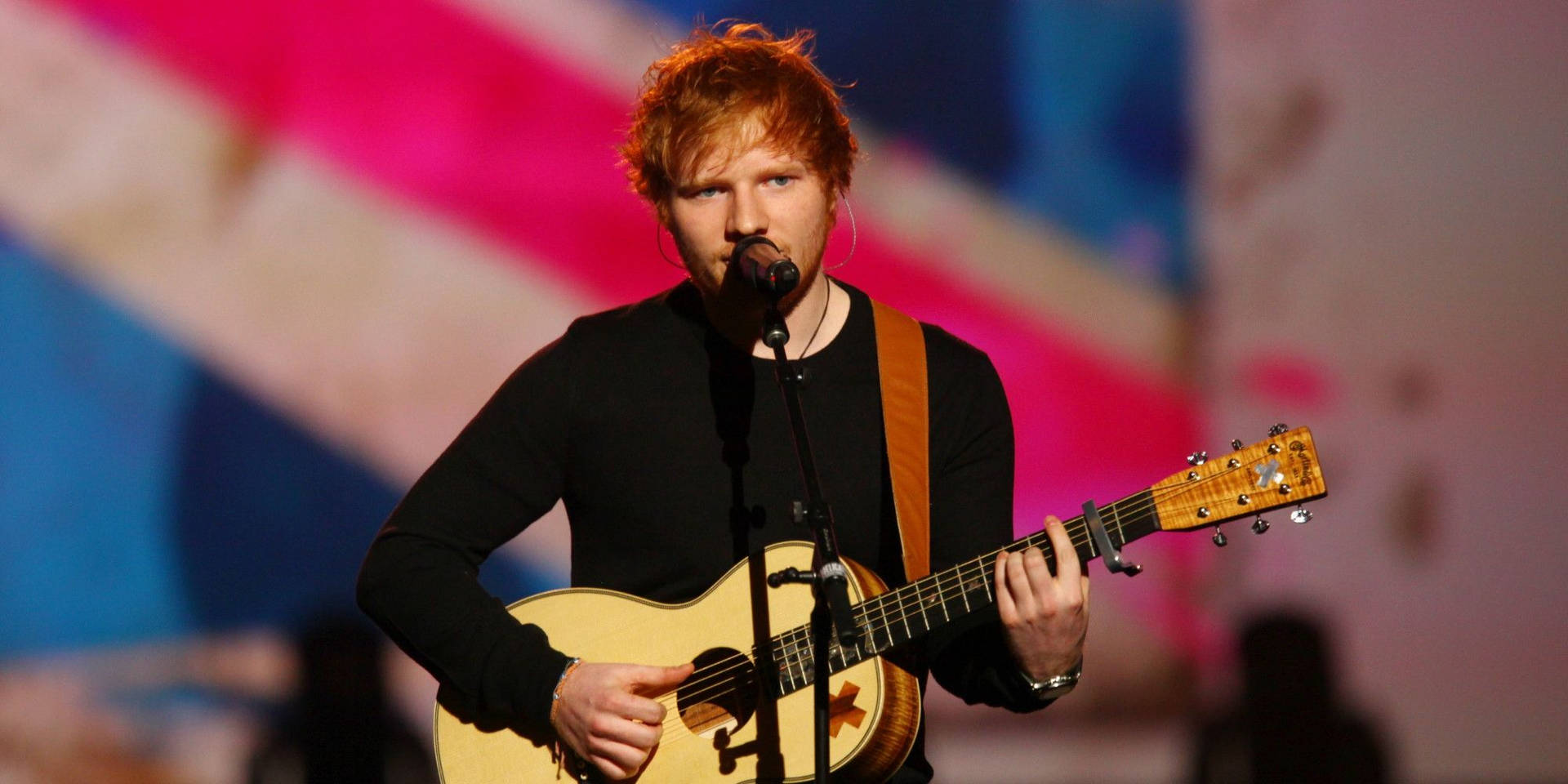 Ed Sheeran Delivering An Incredible Live Performance Background