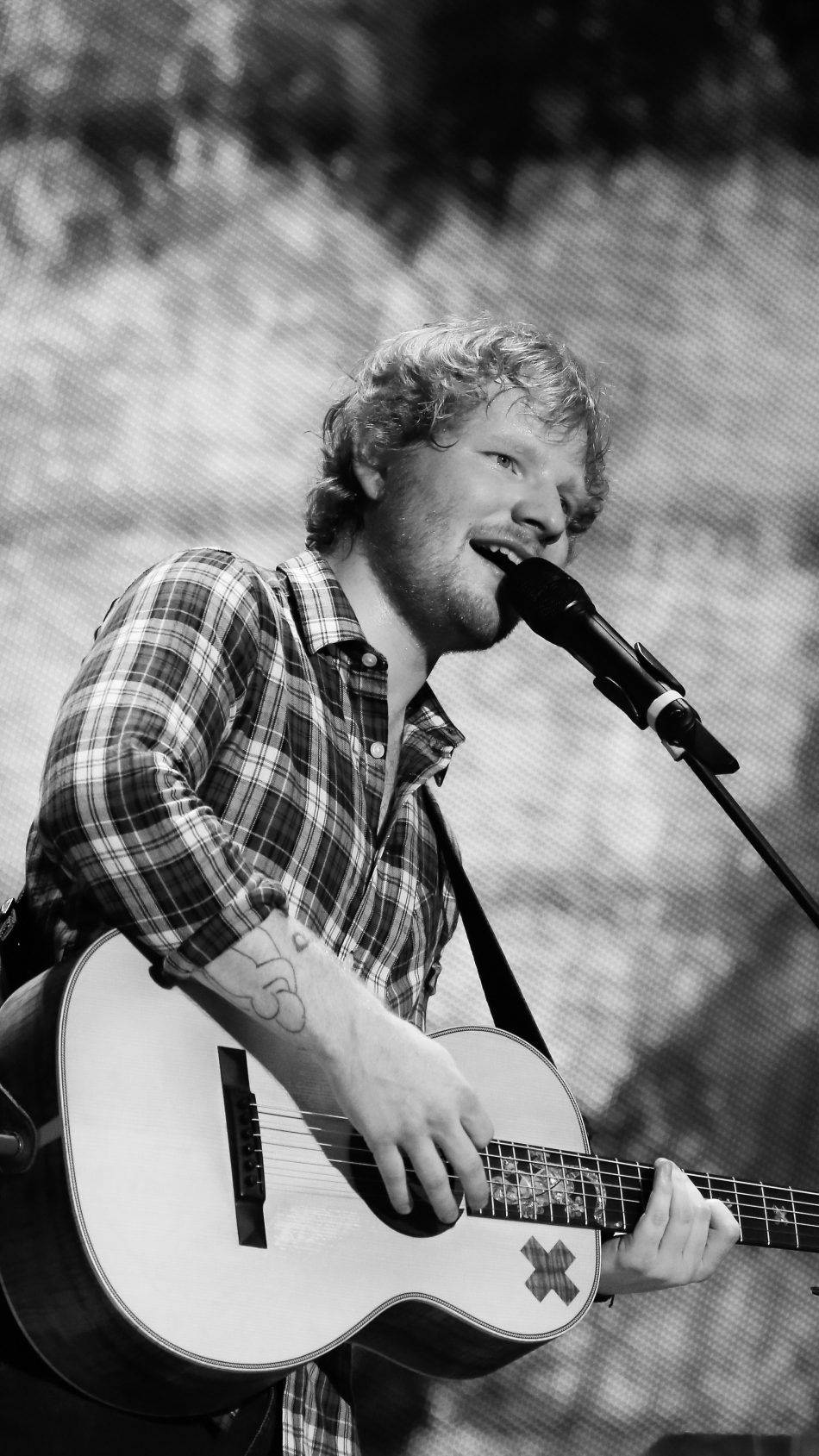 Ed Sheeran In A Calming Black And White Image Background