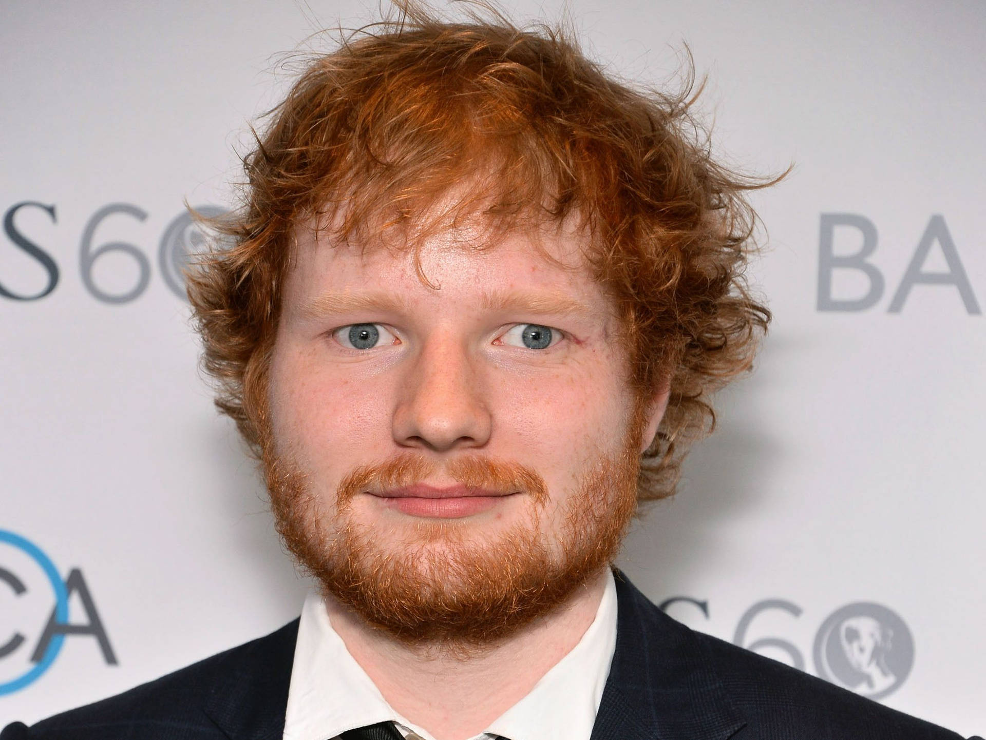 Ed Sheeran Struts The Red Carpet In Style Background