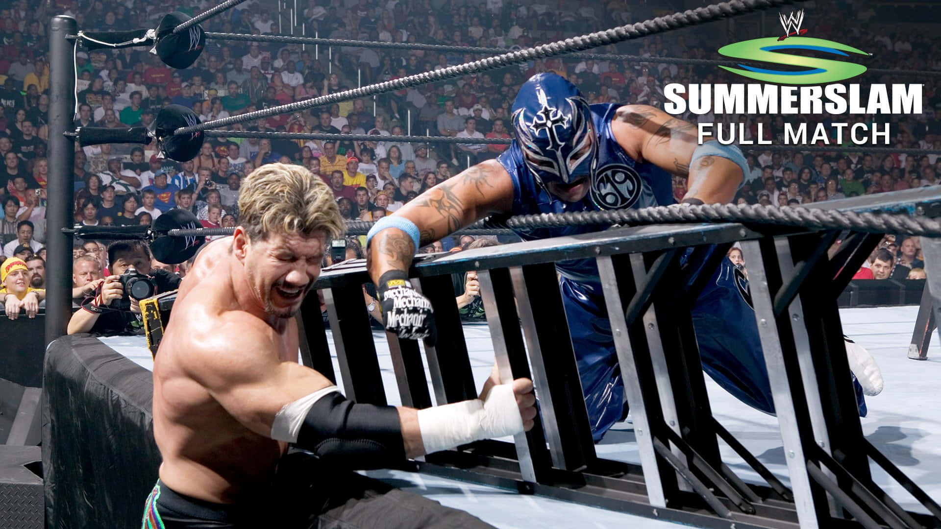 Eddie Guerrero Fighting Rey Mysterio Summer Slam Match Background