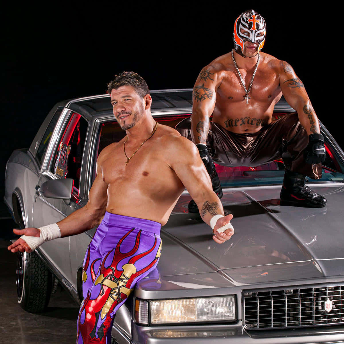 Eddie Guerrero With Rey Mysterio Car Poster Background