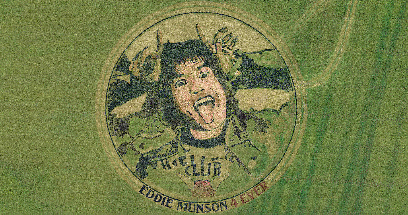 Eddie Munson Drawn On Grass Background