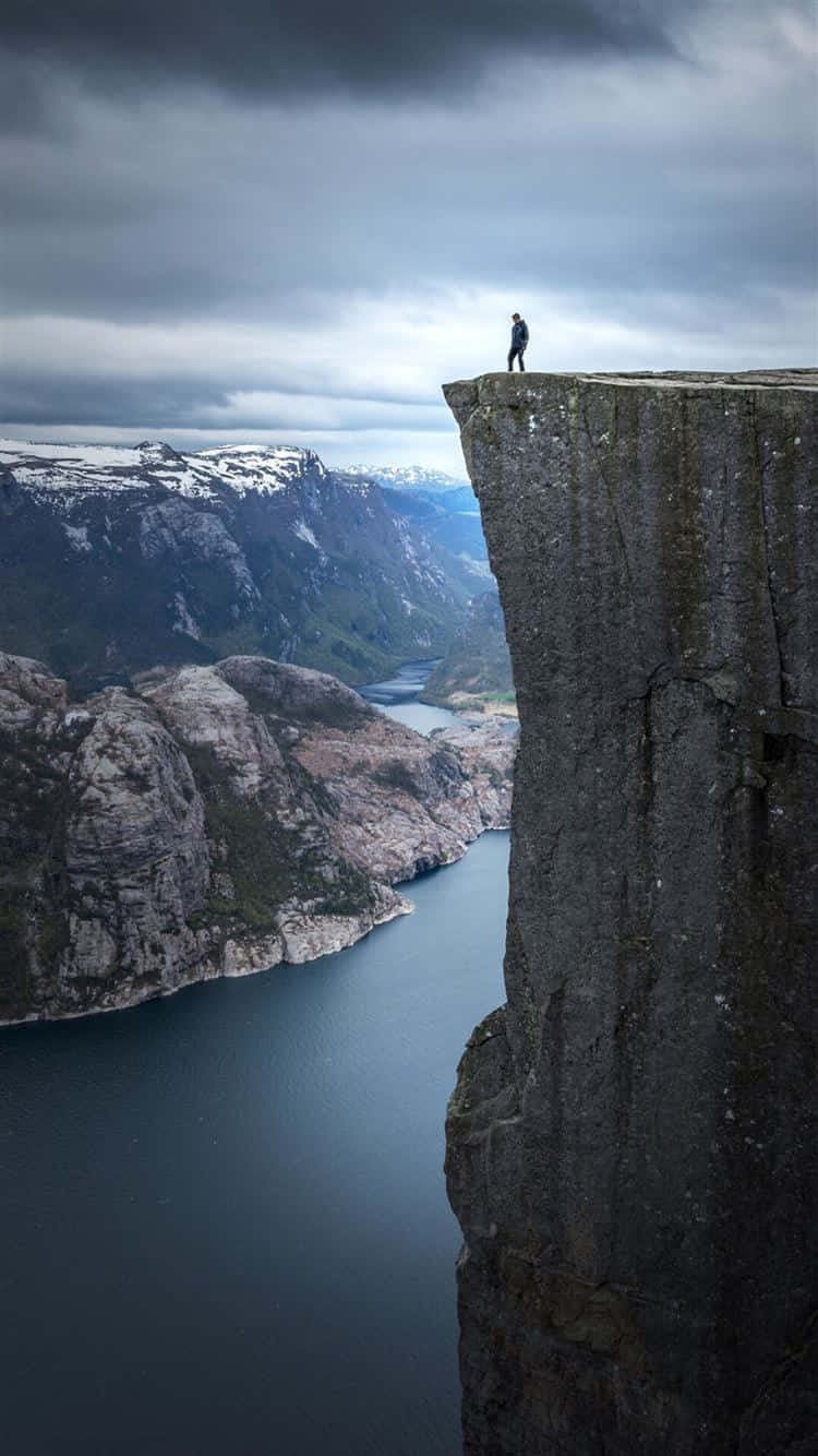 Edge_of_ Cliff_ Overlooking_ Fjord