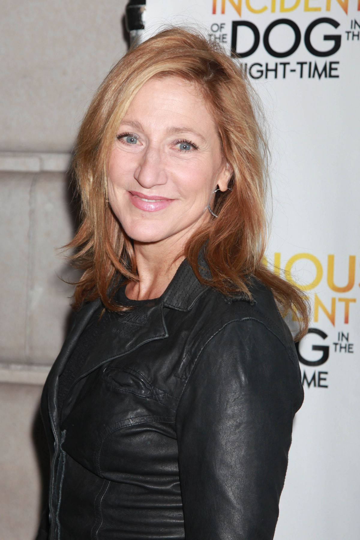 Edie Falco Wearing A Black Leather Jacket