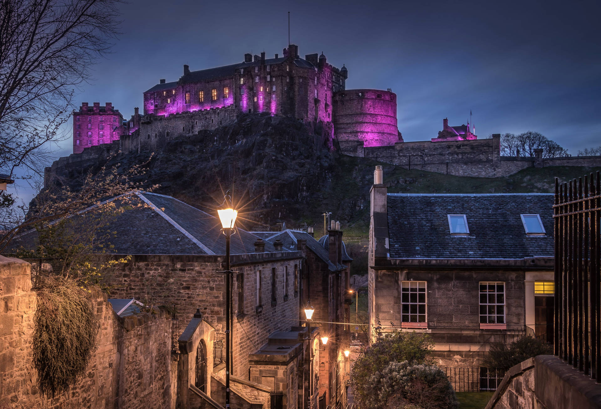 Edinburgh Castle In Purple Lights Background