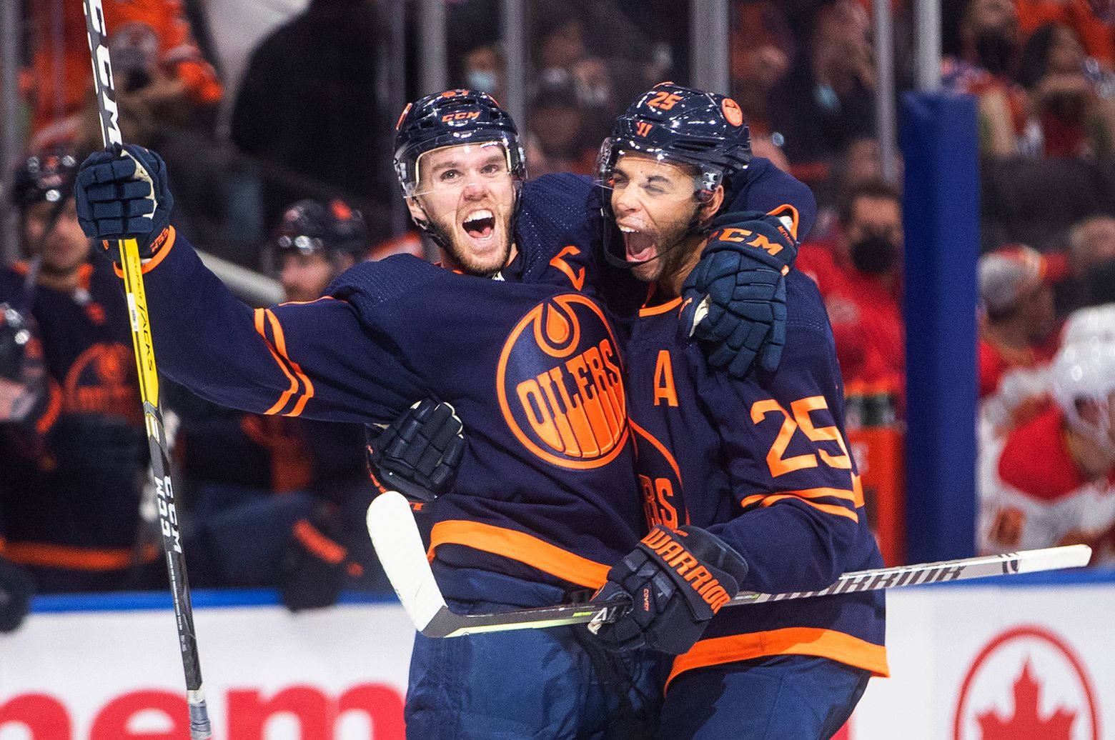 Edmonton Oilers Connor Mcdavid And Darnell Nurse Against Calgary Flames Background