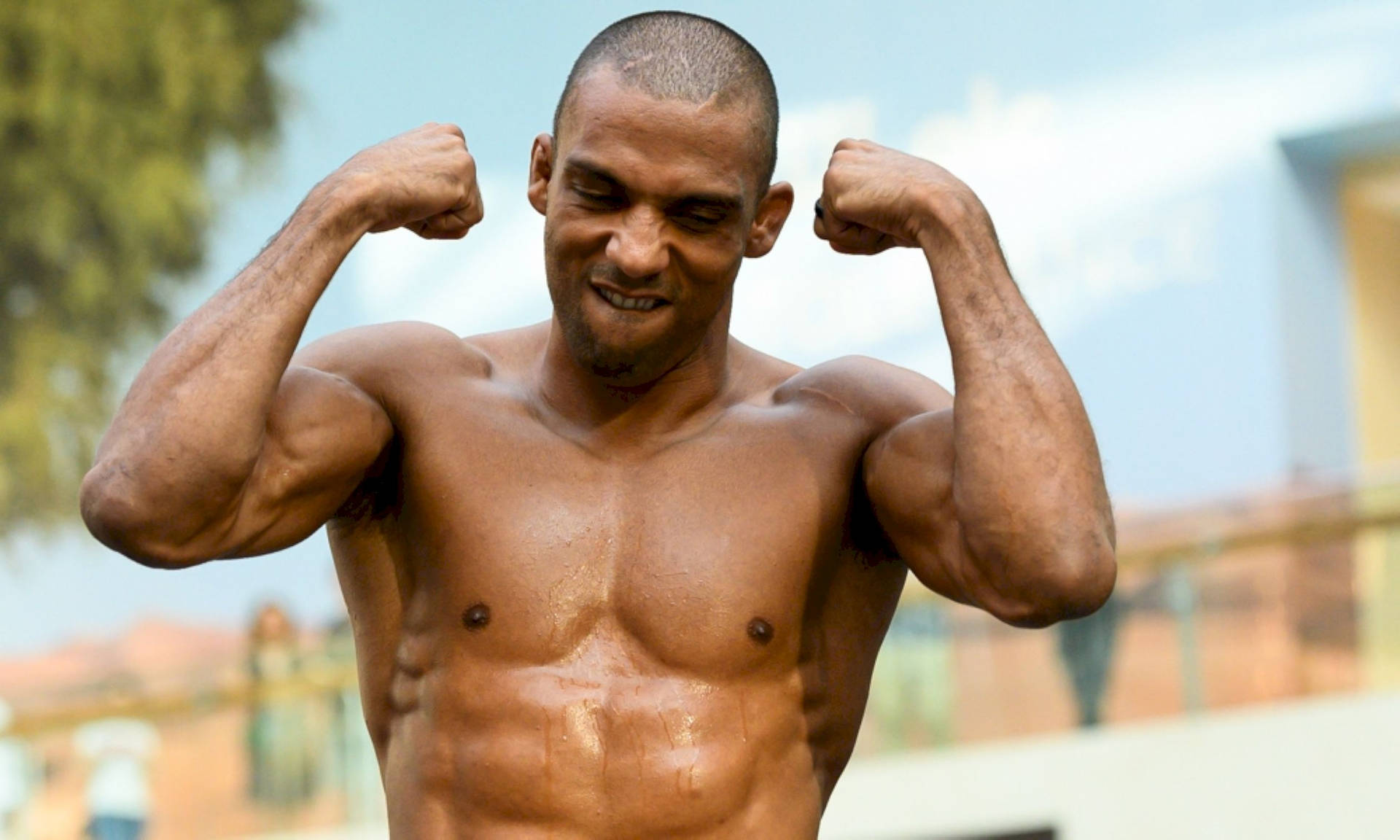 Edson Barboza Gritting His Teeth And Flexing Background