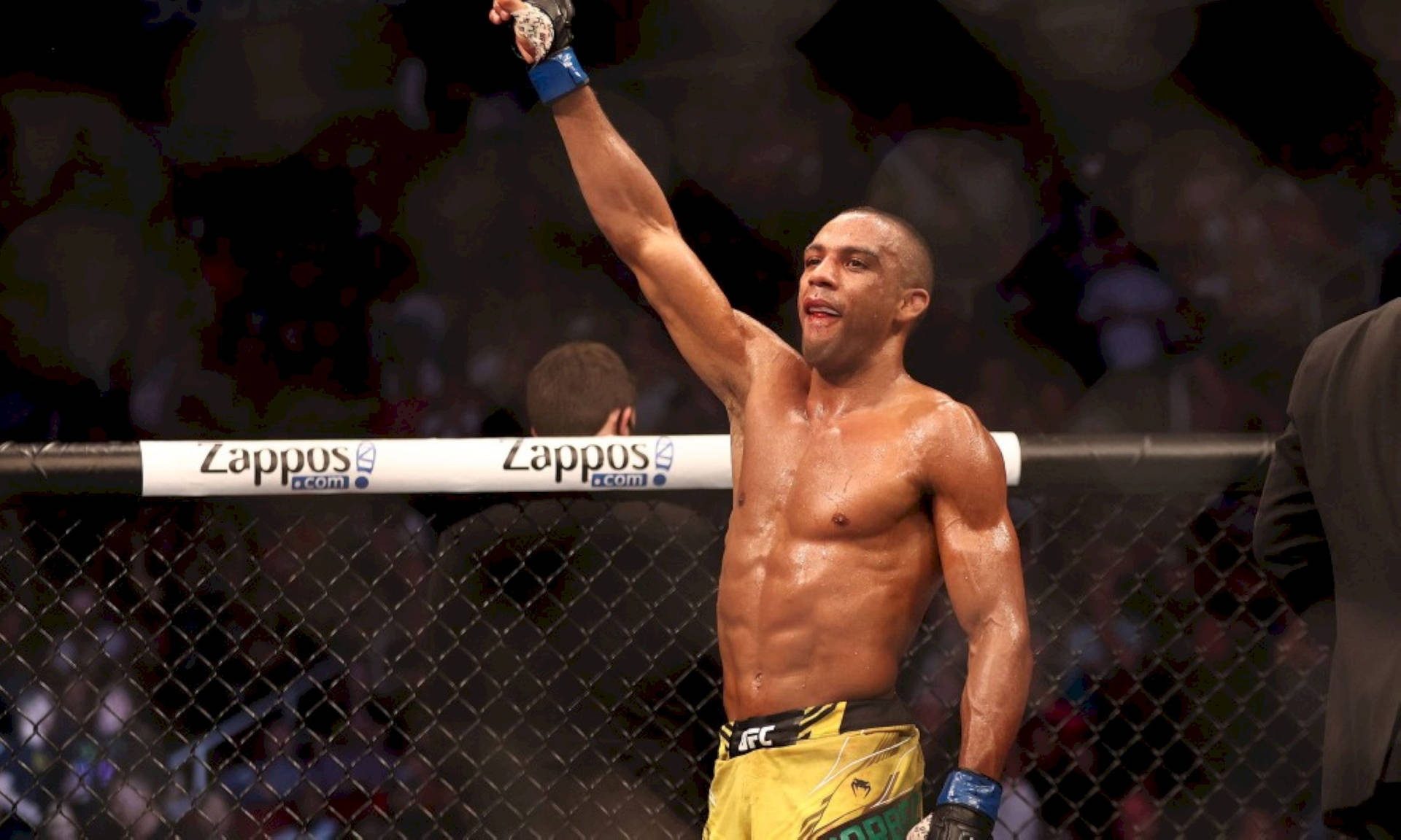 Edson Barboza Triumphantly Raising His Arm In The Ring