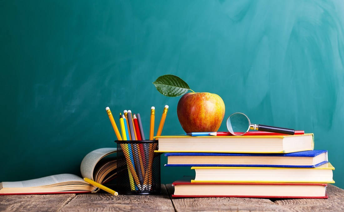 Education Apple And Stack Of Books Background
