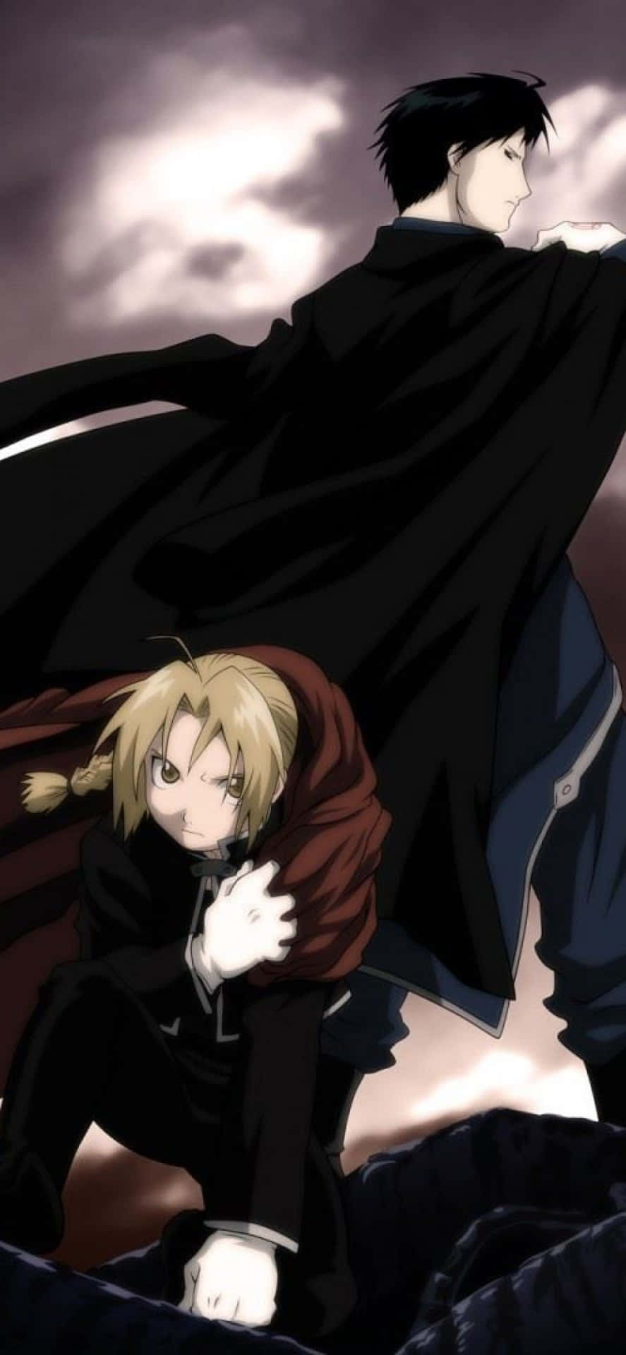 Edward Elric Displaying His Alchemy Prowess In Action Background