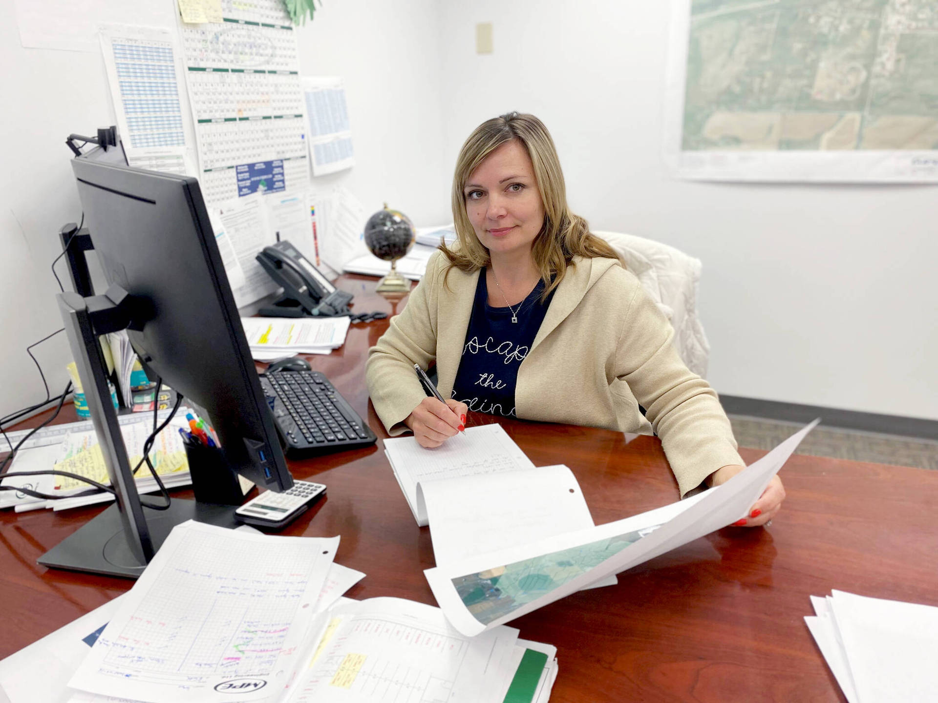 Efficient Secretary At Work In A Residential Building Office Background