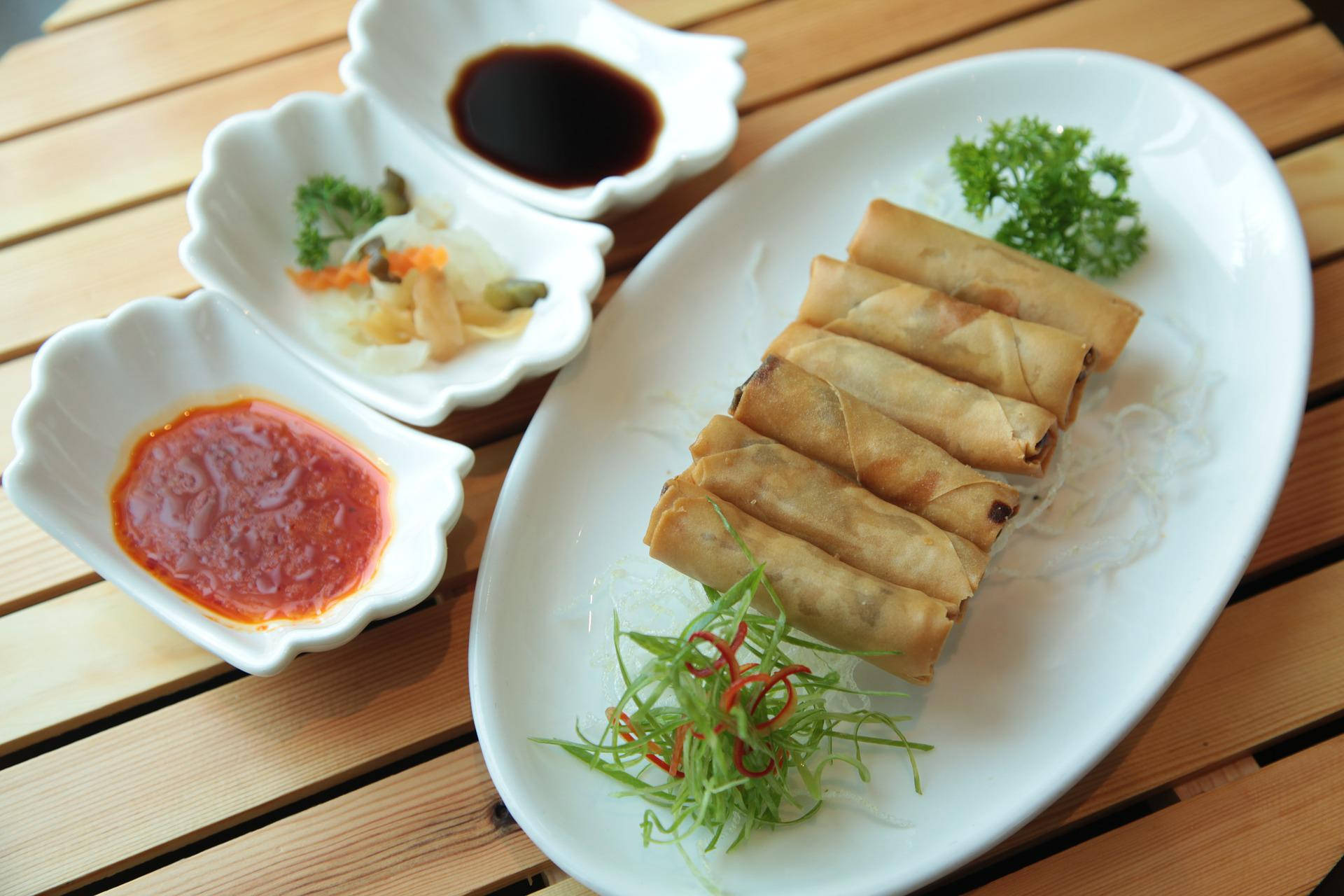 Egg Roll Platter With Three Dips Background