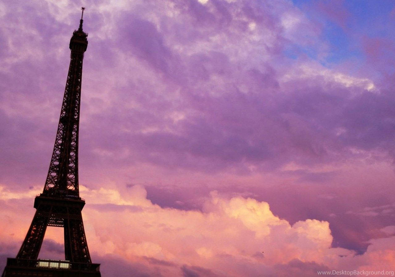 Eiffel Tower With Purple Pink Paris Clouds Background