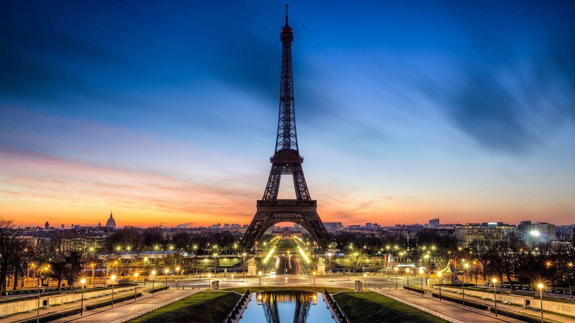 Eiffel Tower With Yellow Lights Around Background