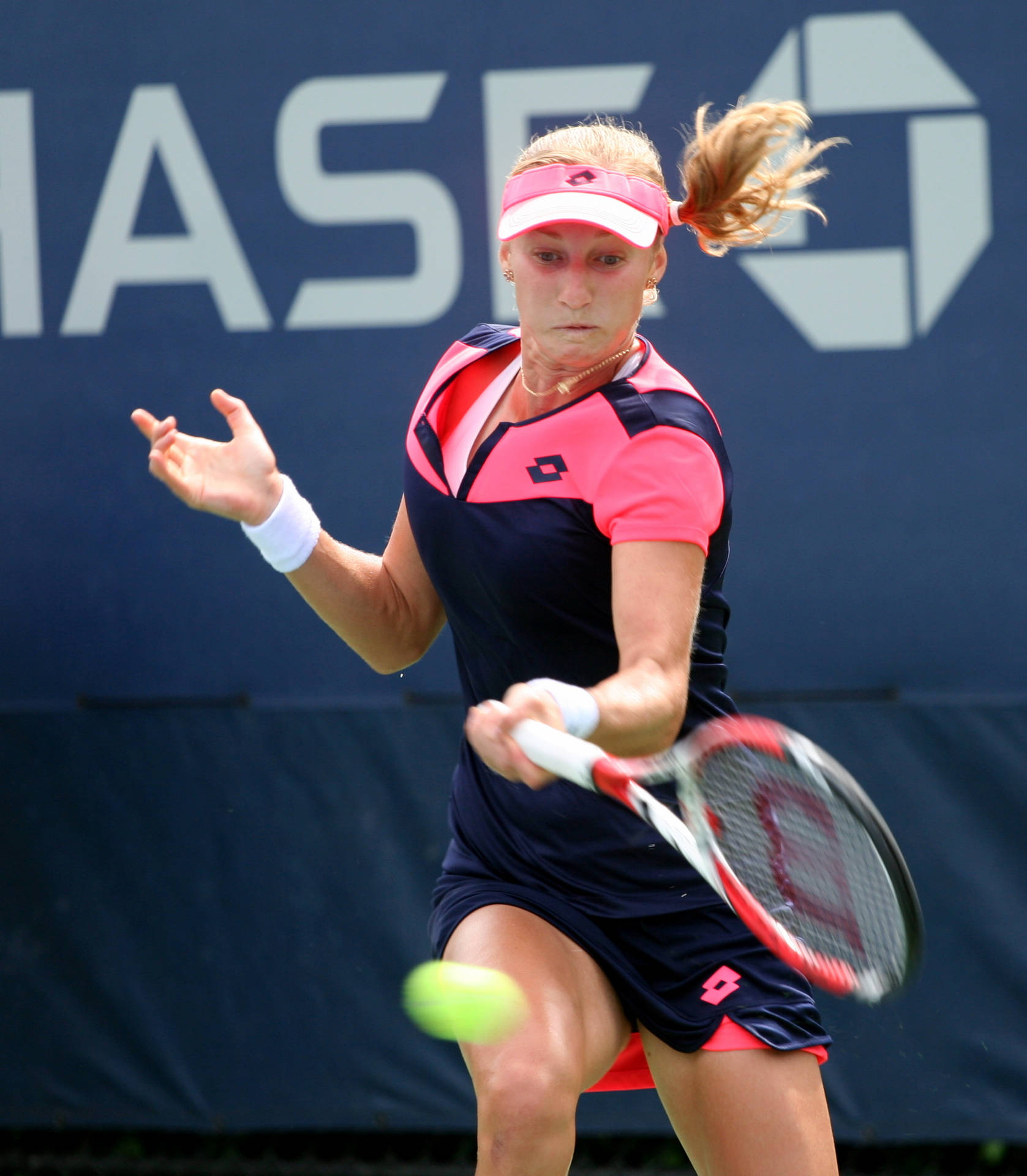 Ekaterina Makarova In Action During Tennis Match Background