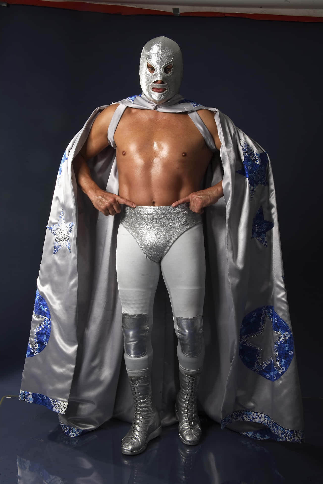 El Hijo Del Santo Wearing El Santo Mask Background