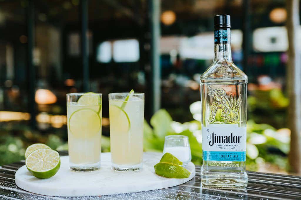 El Jimador Silver Tequila Bottle With Lime Paloma Mix Background