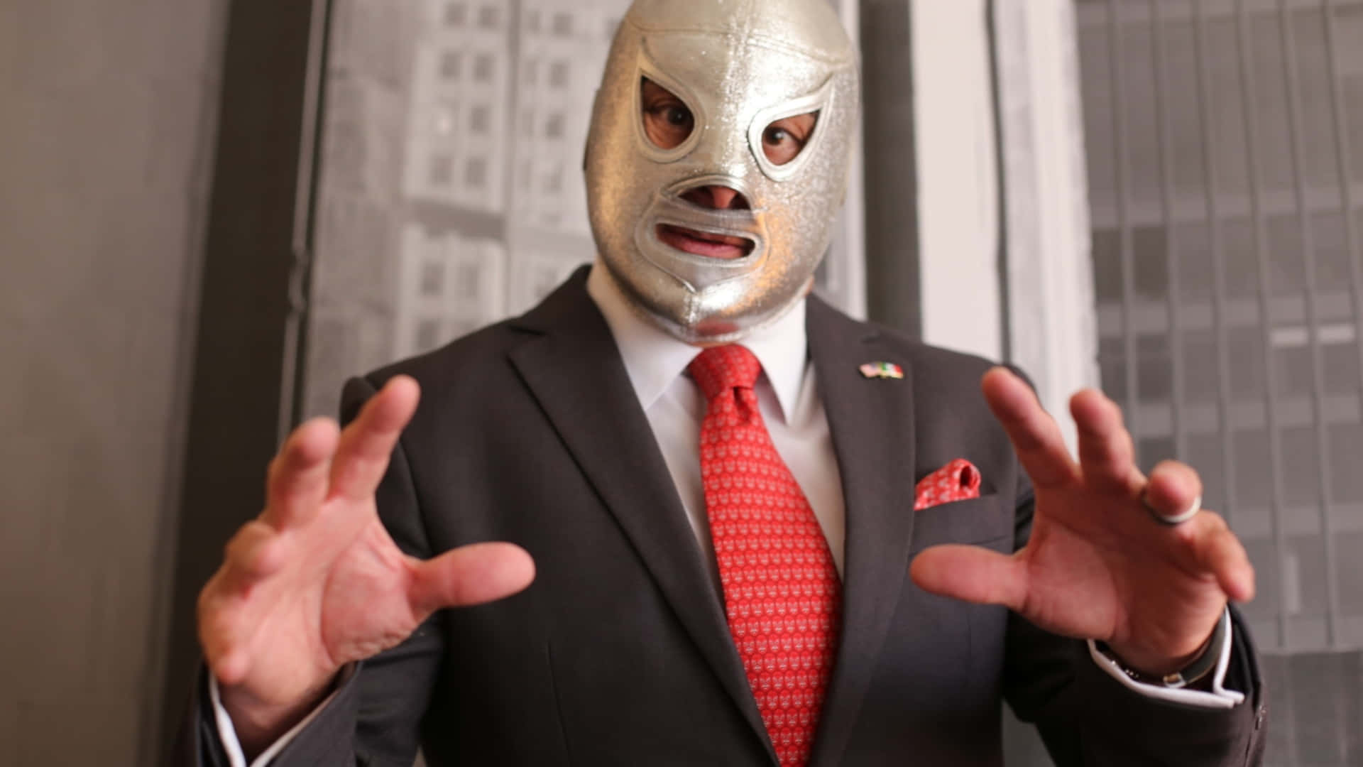 El Santo In Suit Expressive Gesture Background