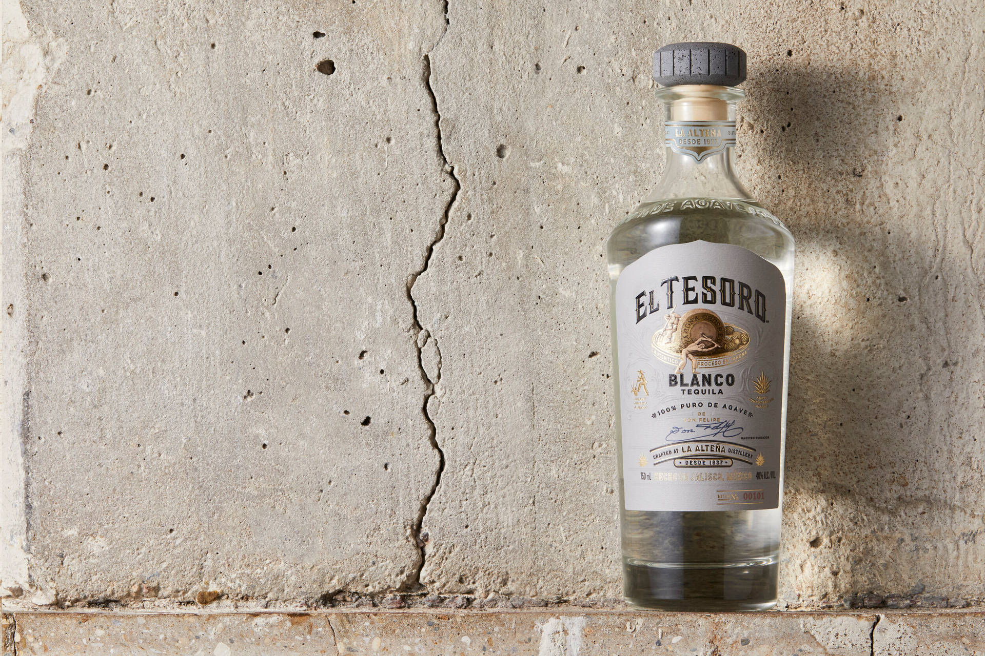 El Tesoro Blanco Tequila On Cracked Wall Background