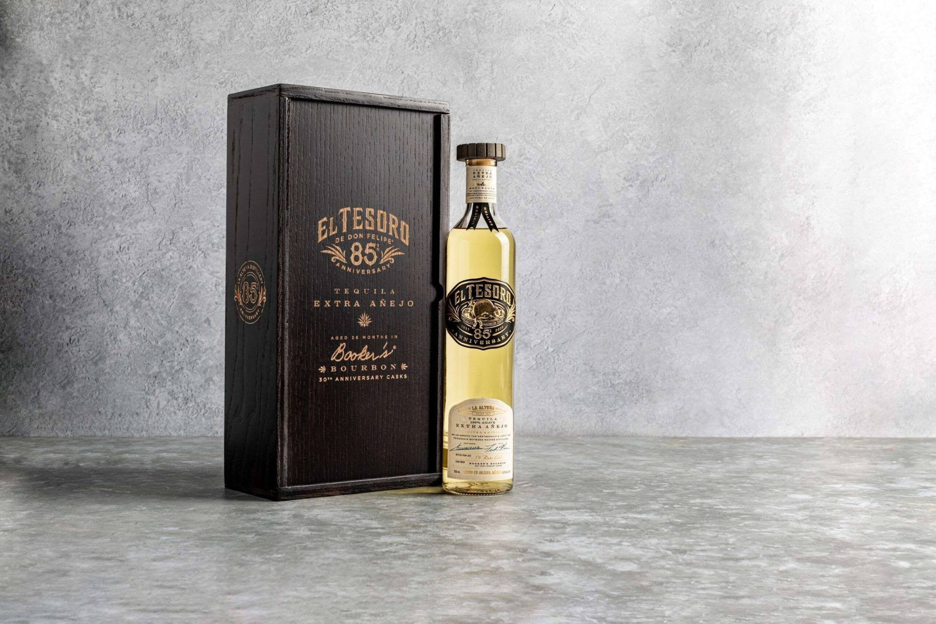 El Tesoro Tequila Bottle And Black Box Background