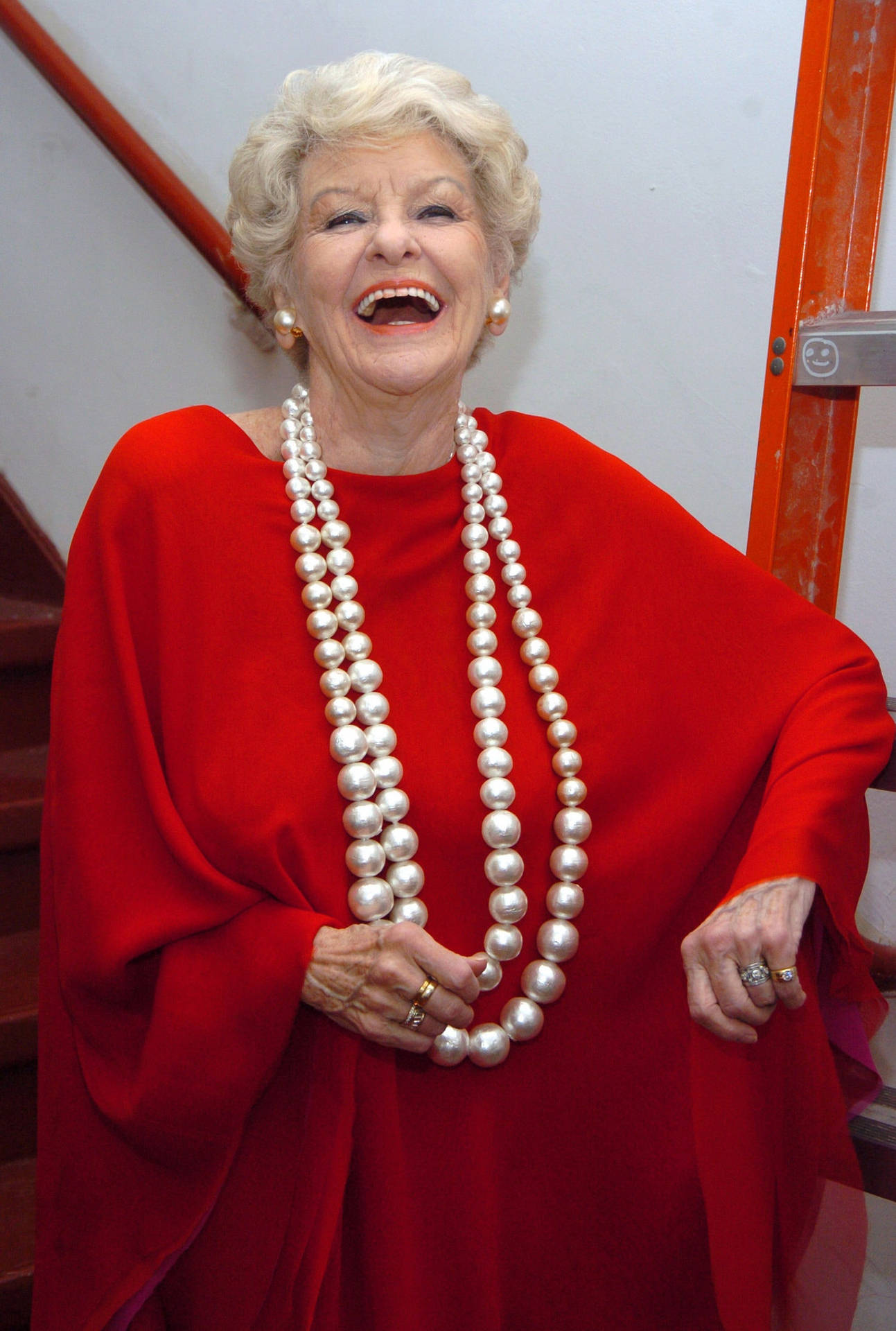 Elaine Stritch Laughing In A Loose Red Top Background