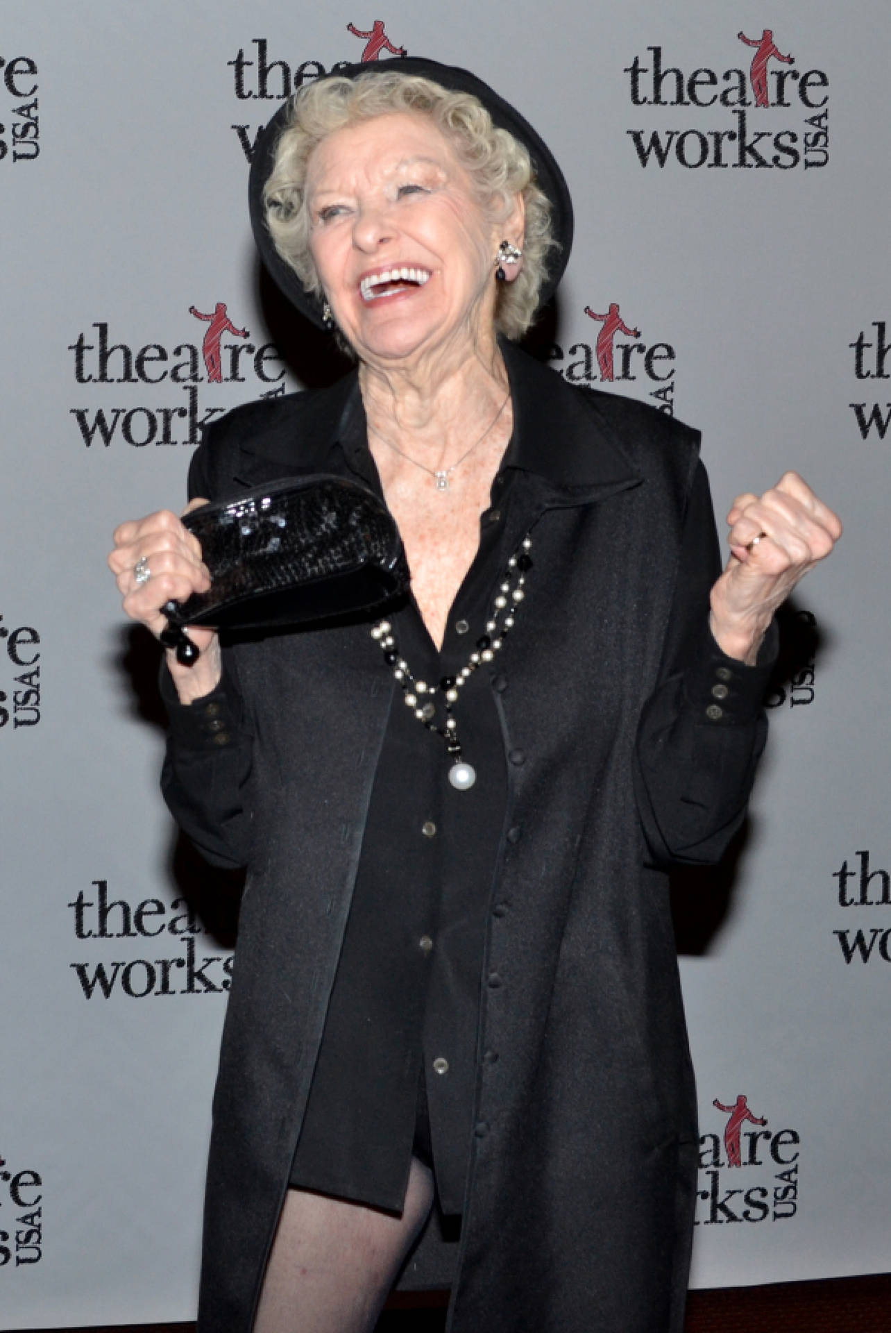 Elaine Stritch Strikes A Happy Pose In An Elegant Black Outfit.