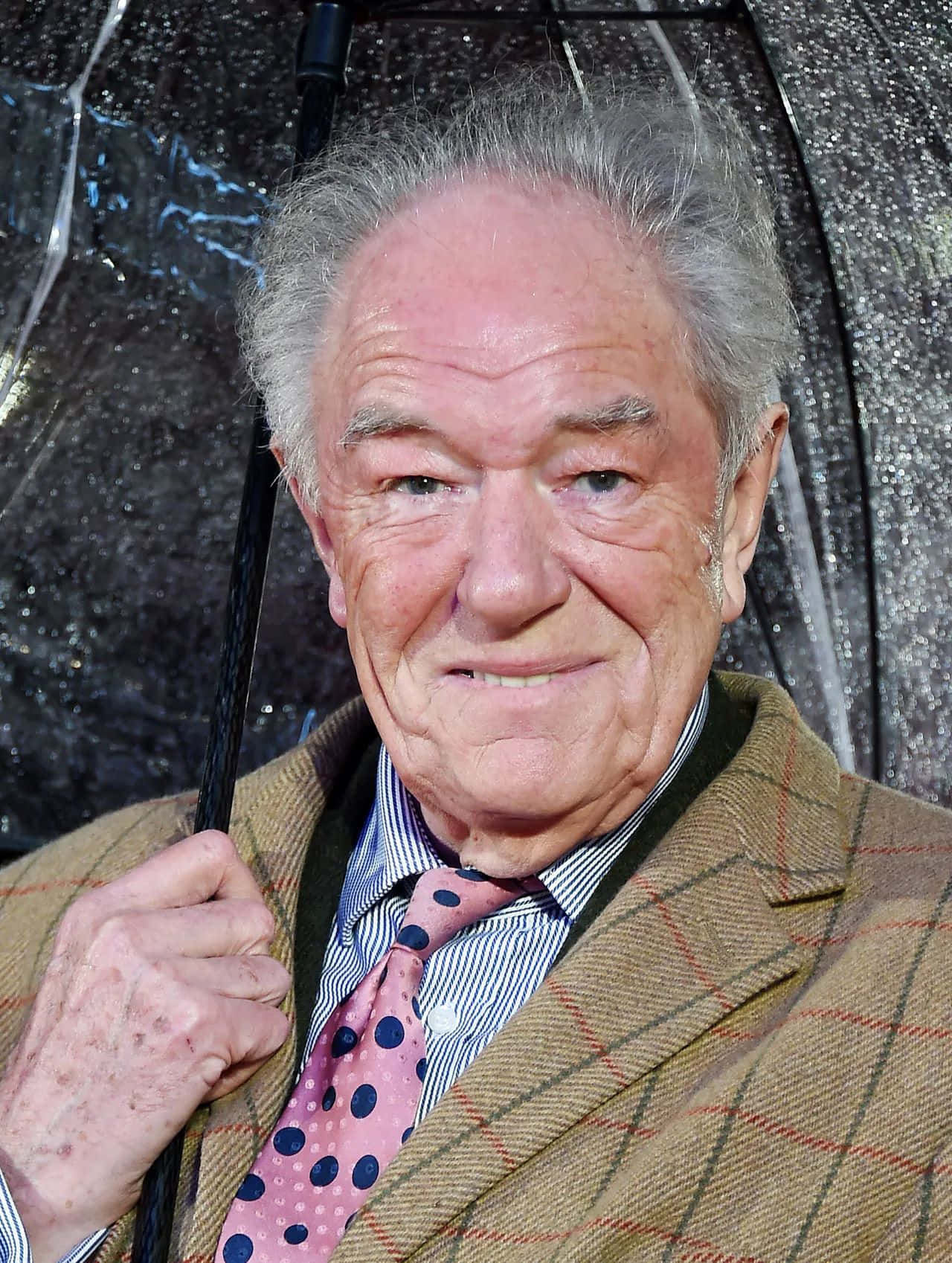 Elderly Actor With Umbrella Background