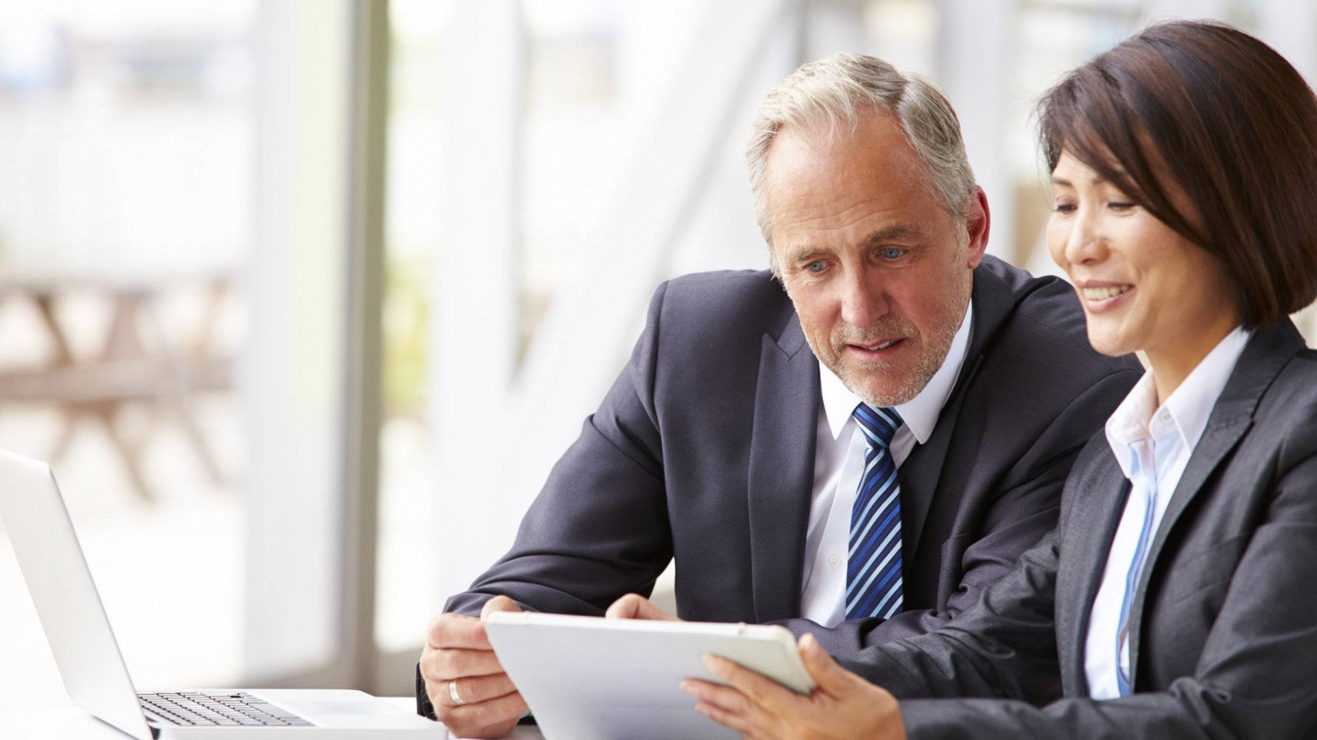 Elderly Consultants In Suit Background