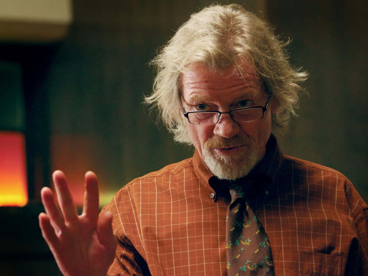 Elderly Man Gesturing During Conversation Background