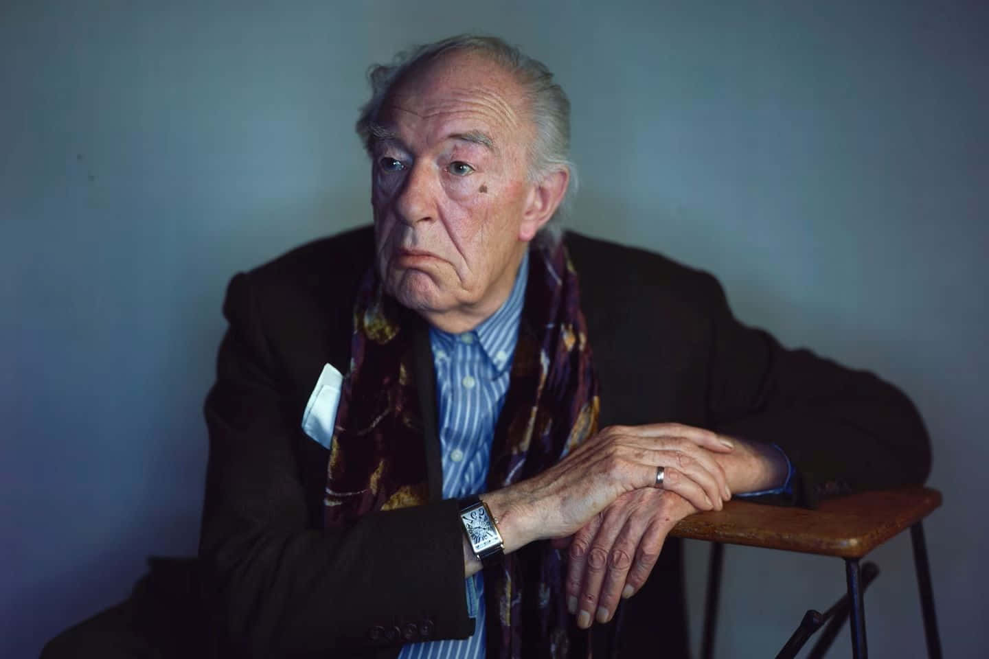 Elderly Man Pensive Look With Scarf Background