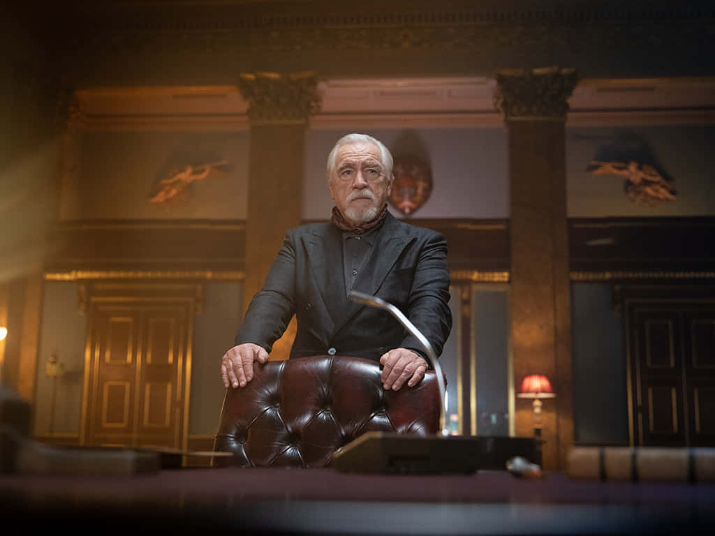 Elderly Man Standing Behind Leather Chair Background