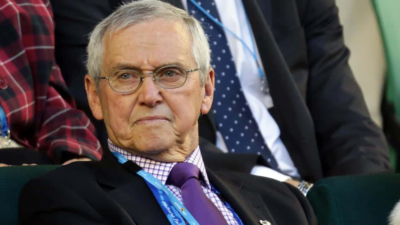 Elderly Man Watching Tennis Match