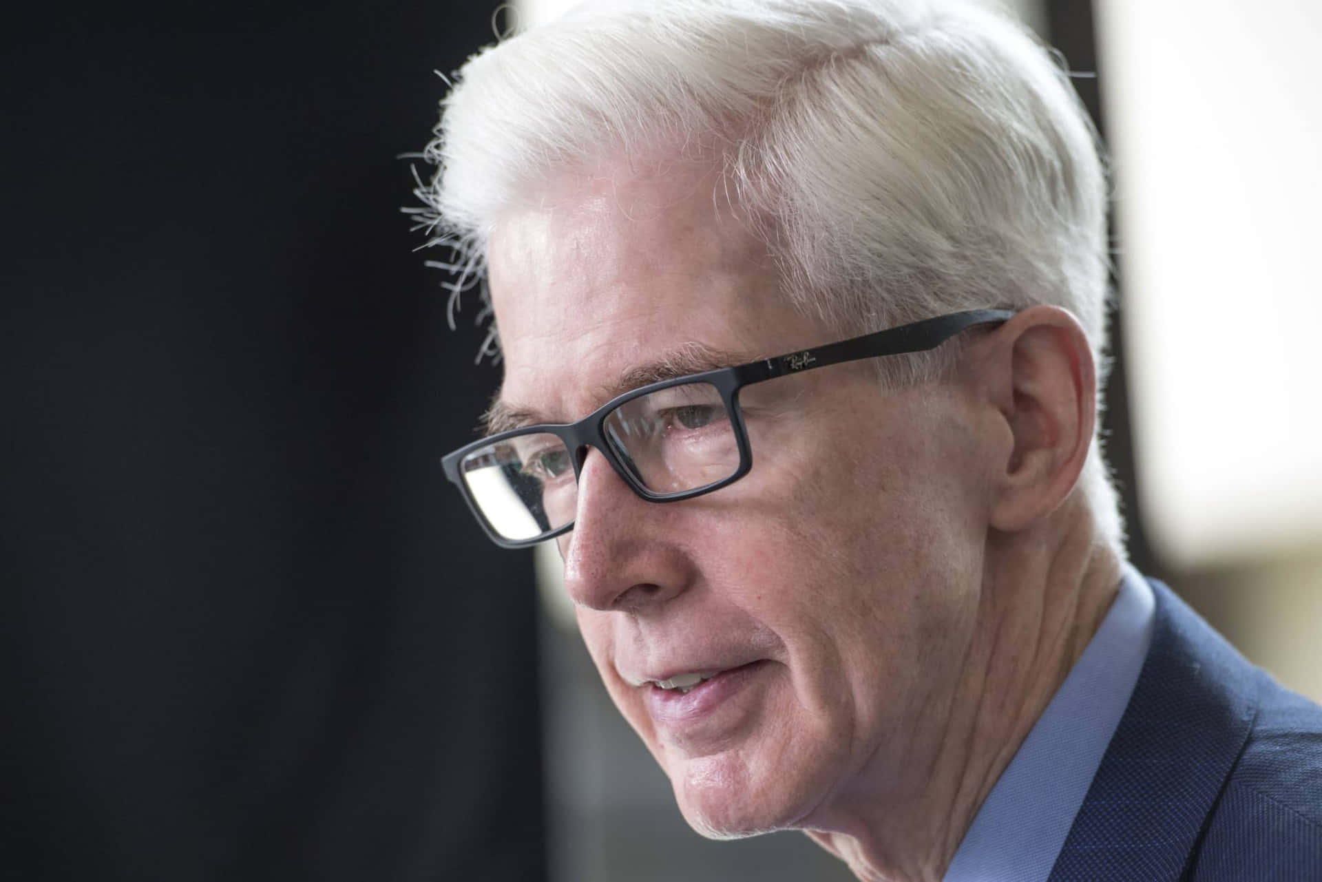 Elderly Manin Glassesand Suit