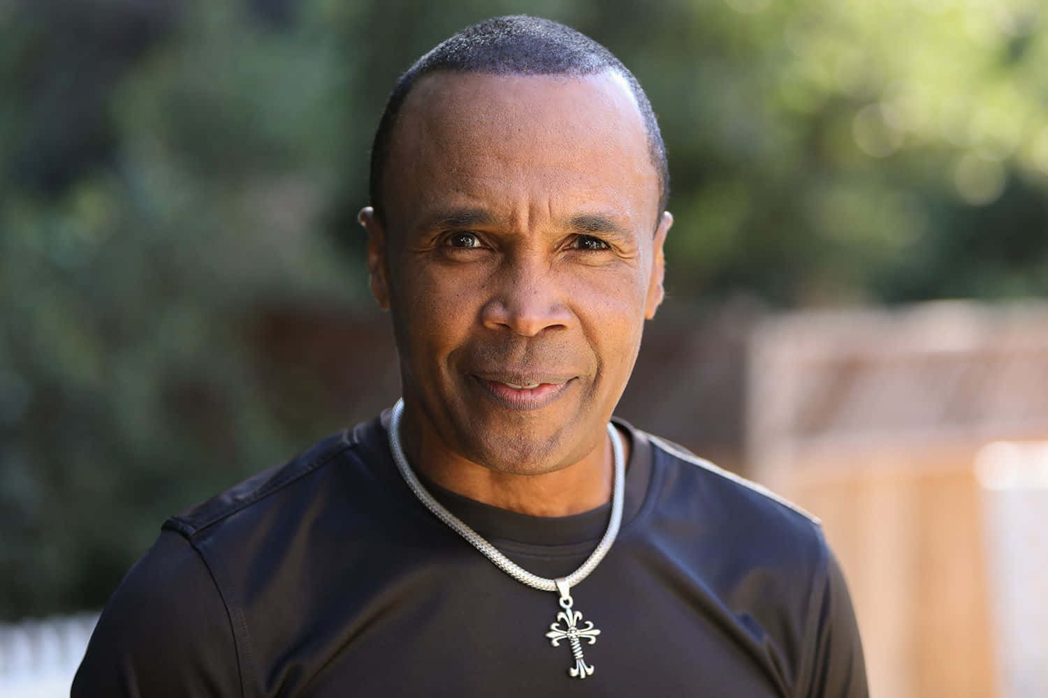 Elderly Ray Leonard Smiling In A Black Shirt