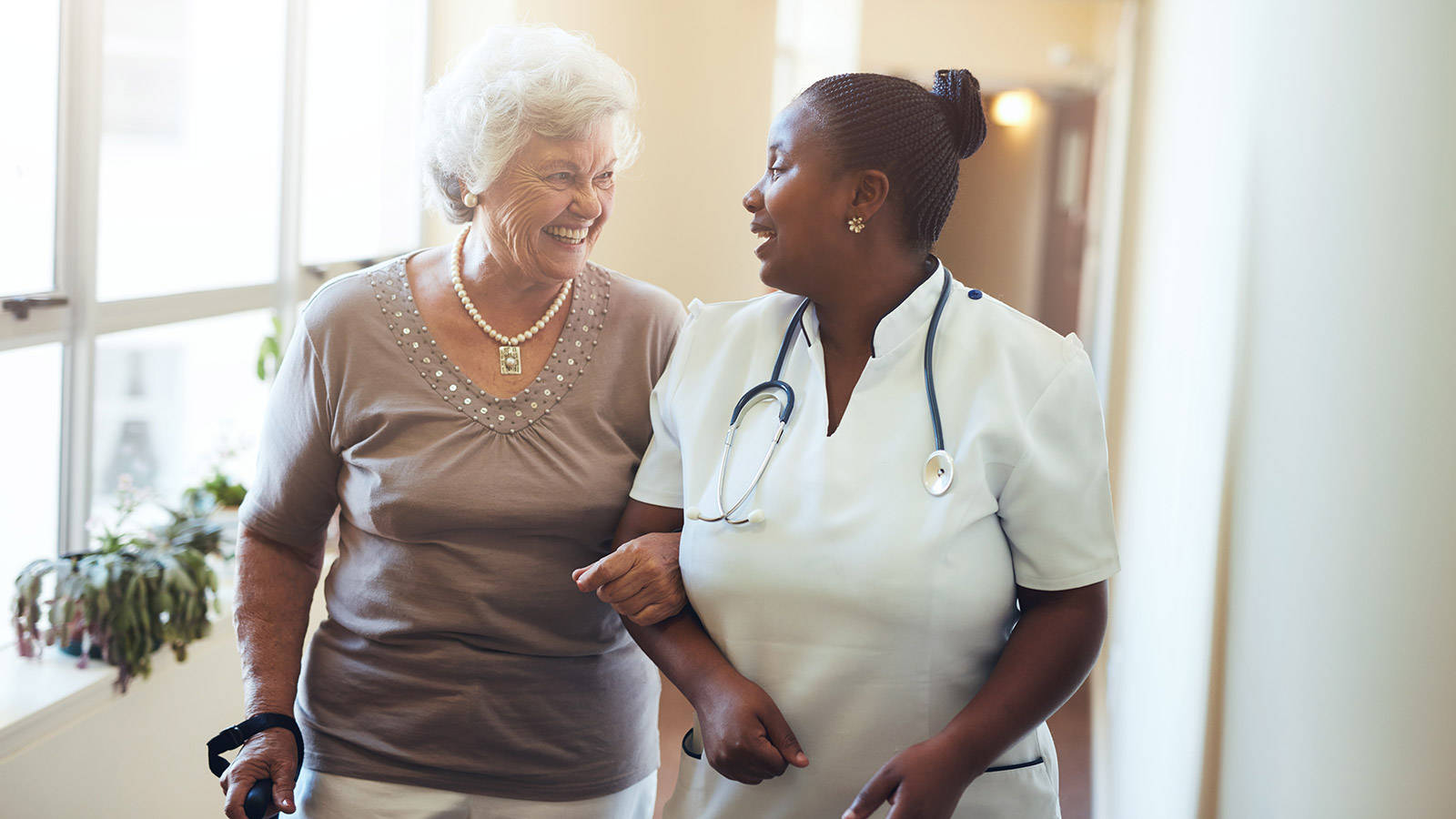 Elderly Woman And Geriatric Nurse Background