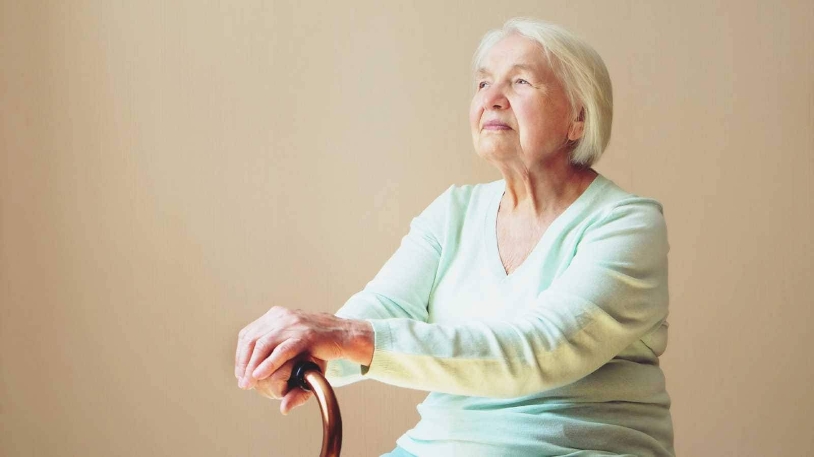 Elderly Woman And Walking Cane Background