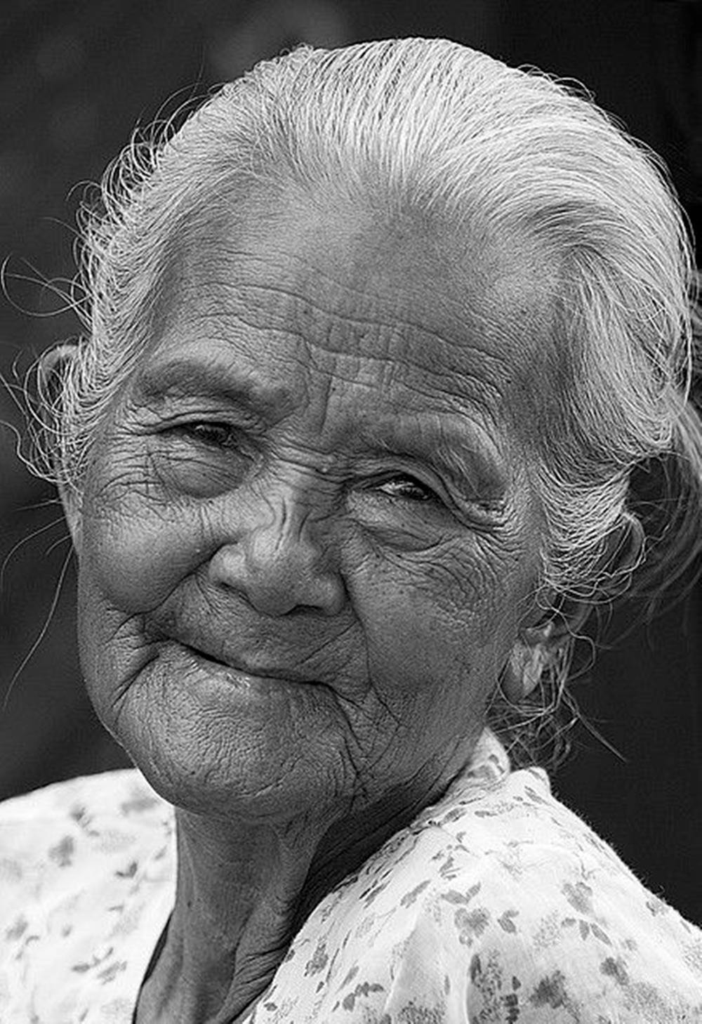 Elderly Woman In Floral Background