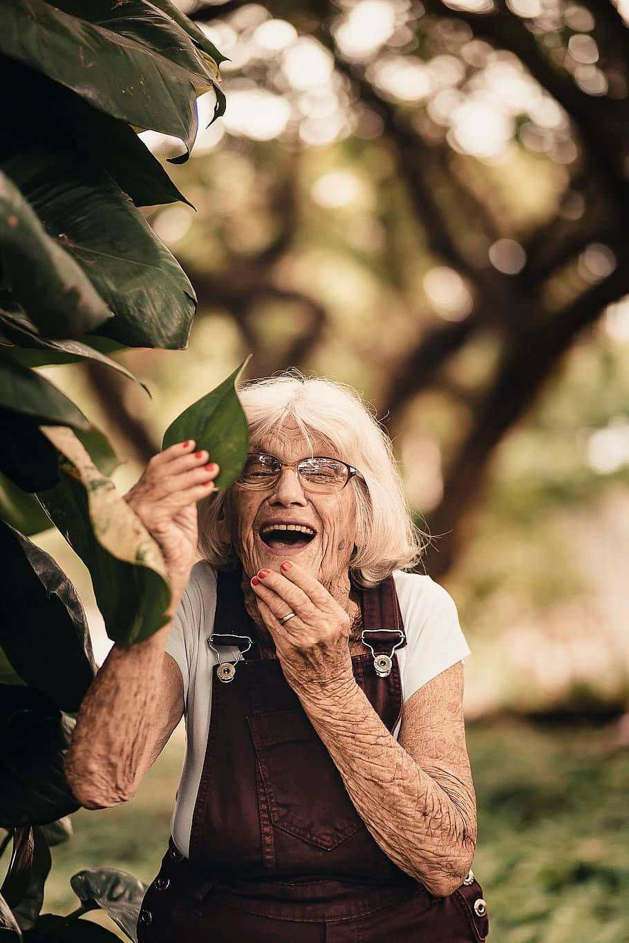 Elderly Woman With A Leaf Background