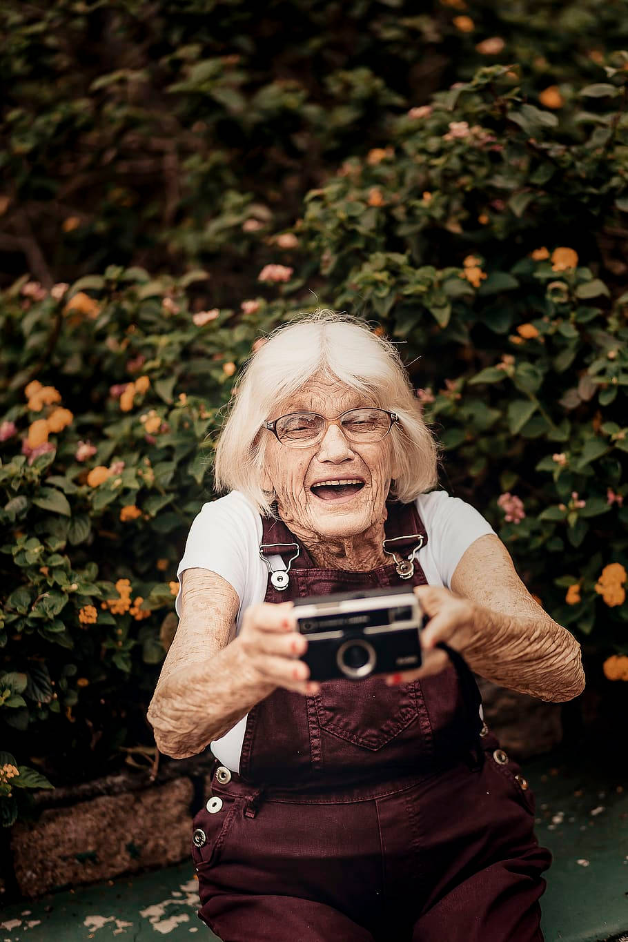 Elderly Woman With Camera Background