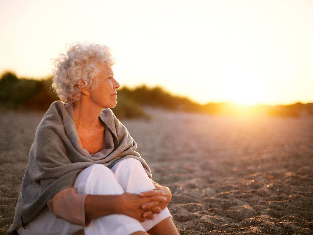 Elderly Woman With Sunset Background