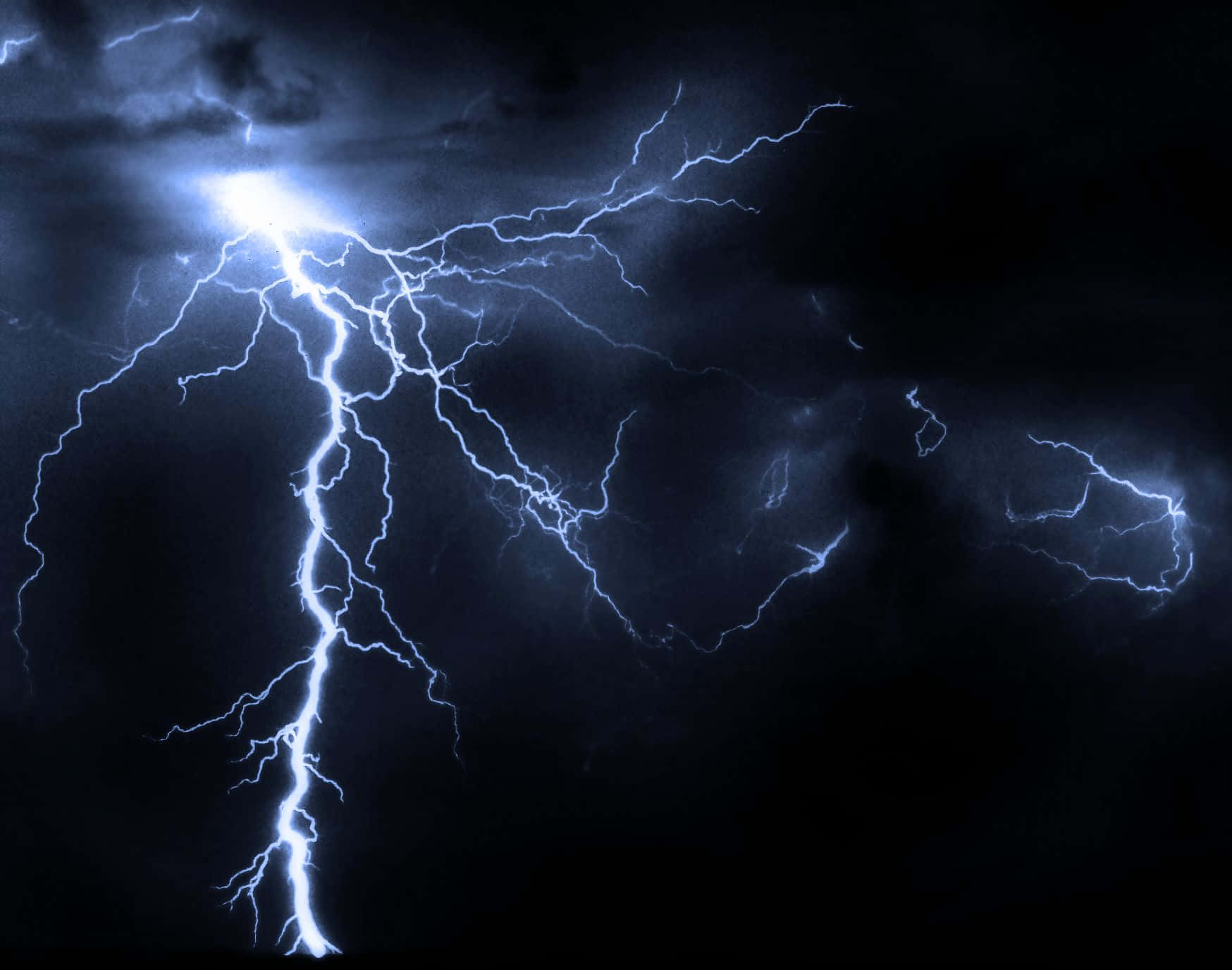 Electric Blues - A Mesmerizing Image Of Blue Lightning In A Dark Night Sky