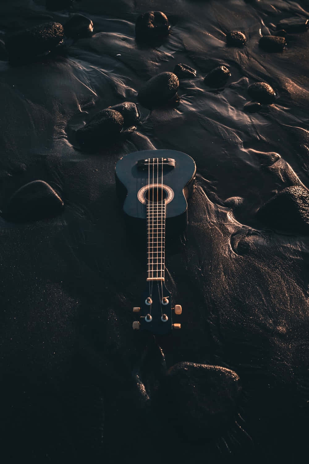 Electric Guitar On A Sand