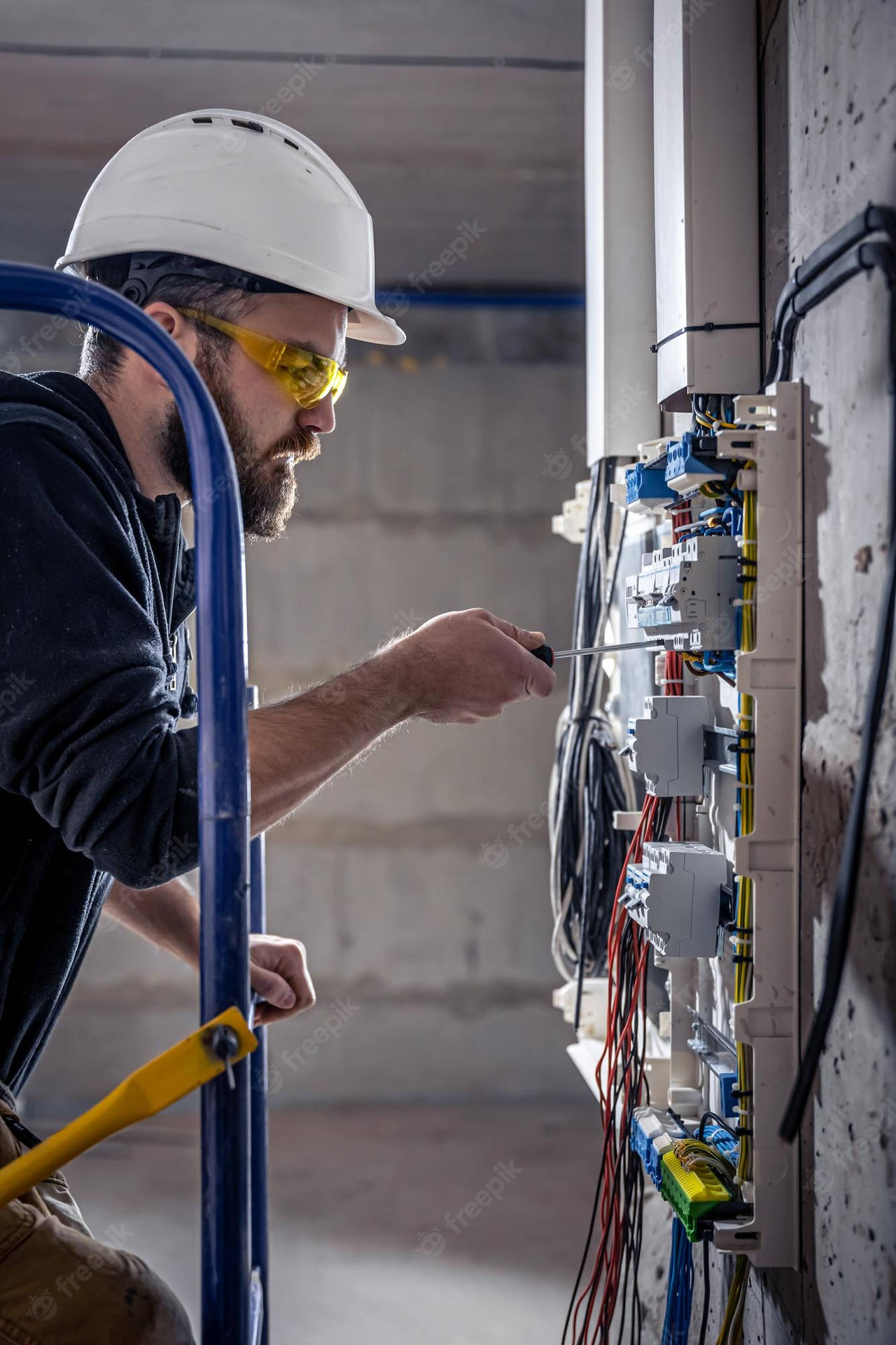 Electrical Technician Inspecting Electronic Wiring Background