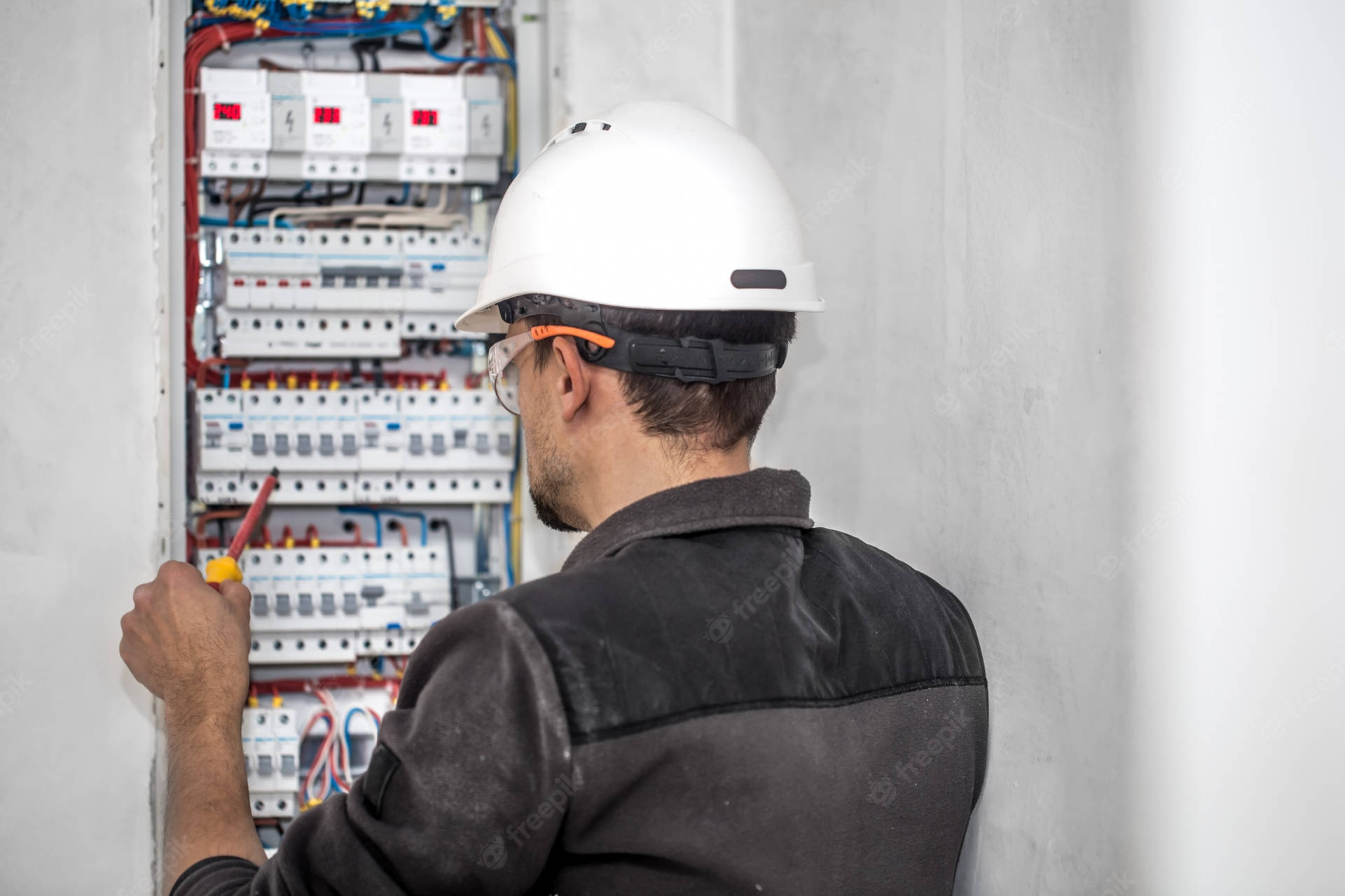 Electrician Checking Voltage Background