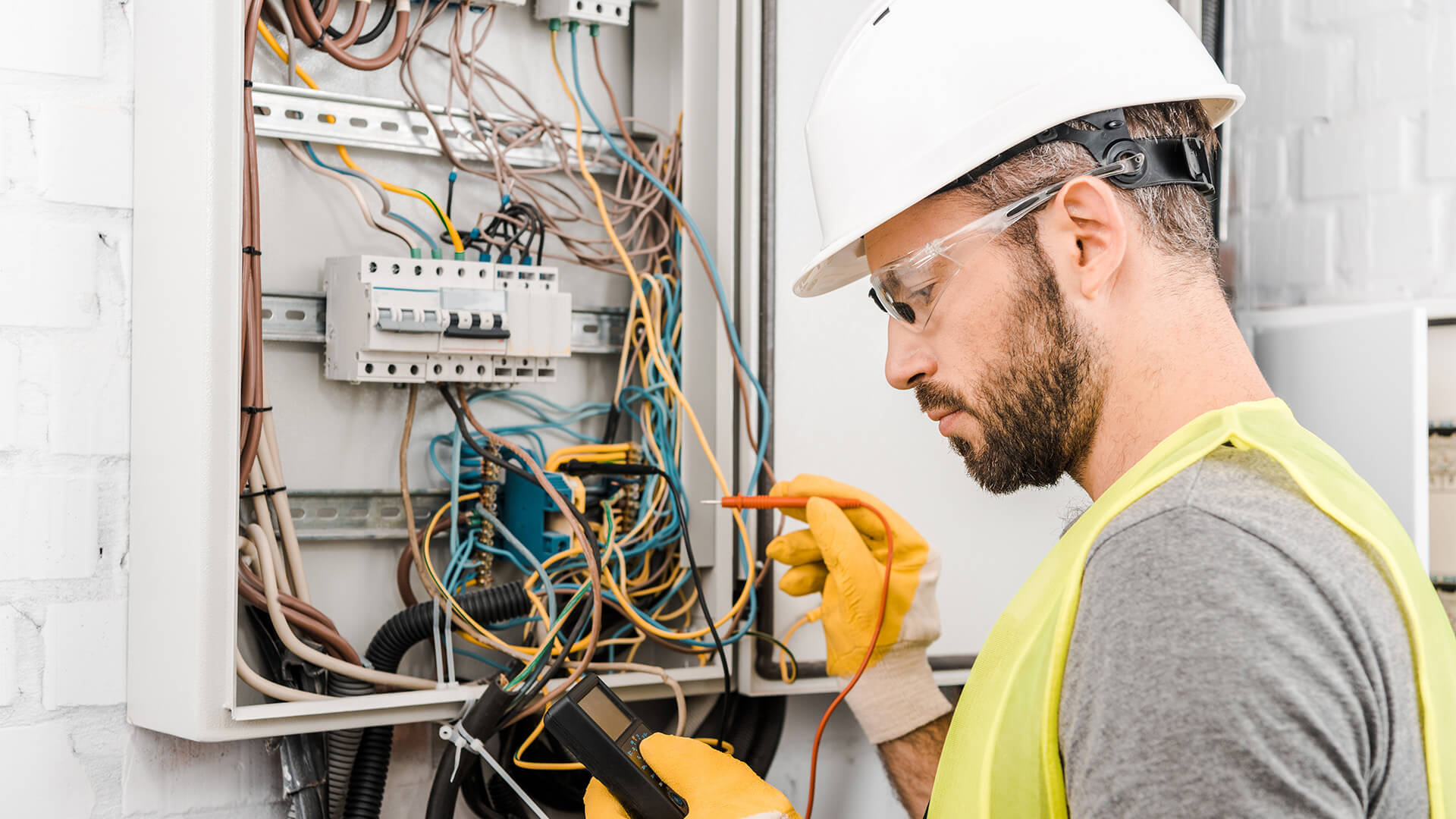 Electrician Checking Wires Background